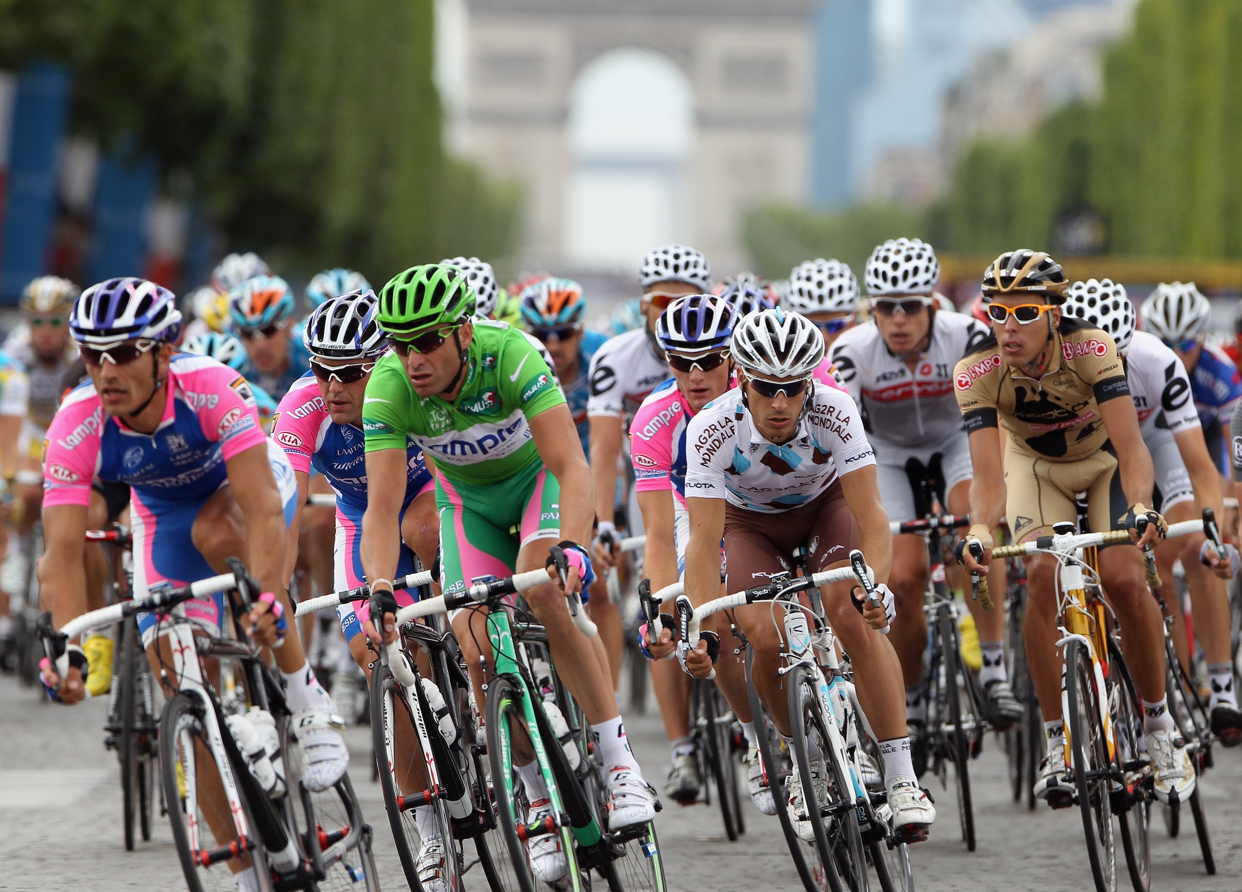 PARIS - JULY 25: Alessandro Petacchi of Lampre Farnisi (2L) rides down the Champs-Elysees during the twentieth and final stage of Le Tour de France 2010, from Longjumeau to the Champs-Elysees in Paris on July 25, 2010 in Paris, France. (Photo by Bryn Le PARIS - JULY 25: Alessandro Petacchi of Lampre Farnisi (2L) rides down the Champs-Elysees during the twentieth and final stage of Le Tour de France 2010, from Longjumeau to the Champs-Elysees in Paris on July 25, 2010 in Paris, France. (Photo by Bryn Le