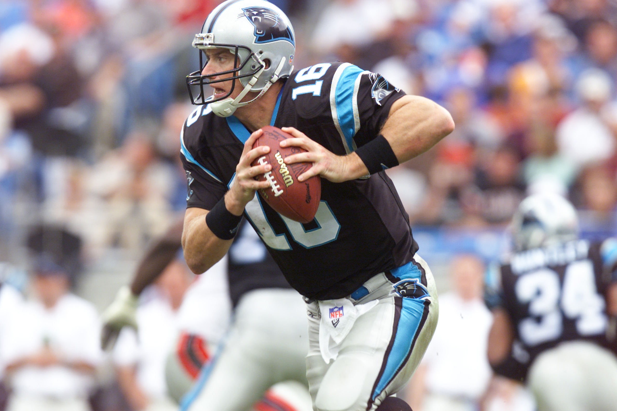 25 Nov 2001 : Chris Weinke of the Carolina Panthers runs with the ball against the Atlanta Falcons during the game at Ericsson Stadium in Charlotte, North Carolina. The Falcons won 10-7. DIGITAL IMAGE. Mandatory Credit: Craig Jones/Allsport