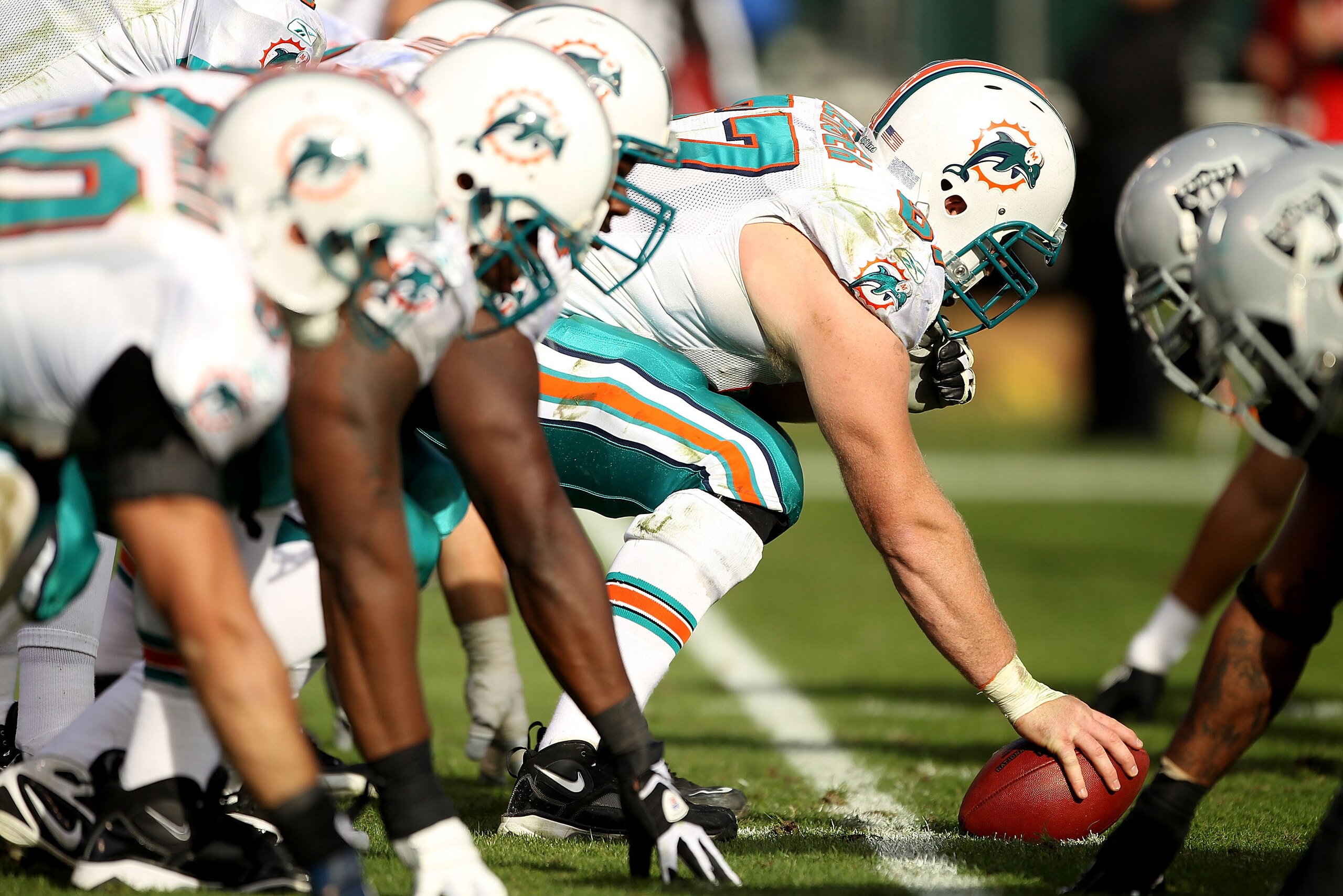 OAKLAND, CA - NOVEMBER 28: Joe Berger #67 of the Miami Dolphins in action against the Oakland Raiders at Oakland-Alameda County Coliseum on November 28, 2010 in Oakland, California.  (Photo by Ezra Shaw/Getty Images)