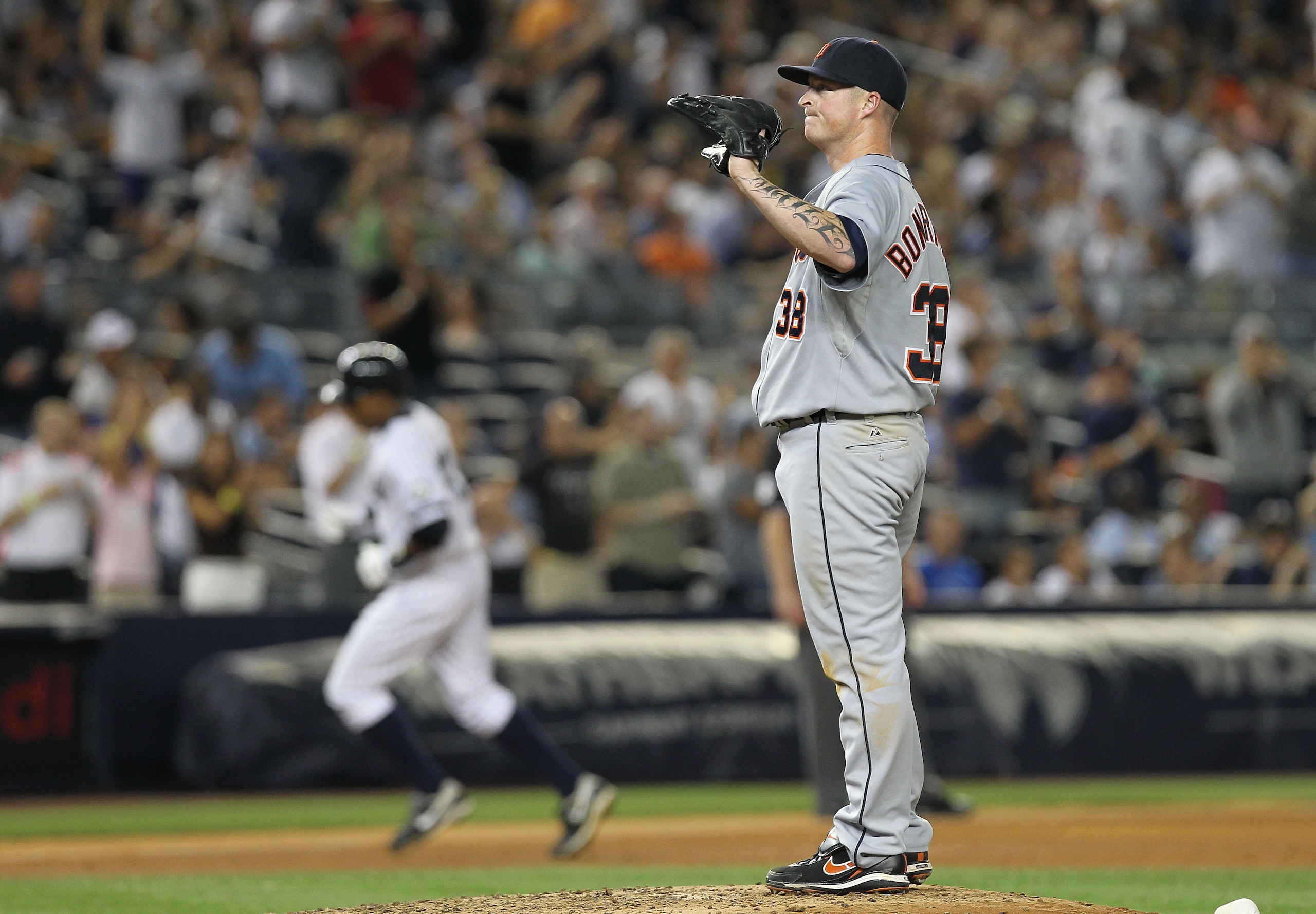 NEW YORK - AUGUST 18:  Jeremy Bonderman #38 of the Detroit Tigers reacts as Curtis Granderson #14 of the New York Yankees rounds the bases at Yankee Stadium on August 18, 2010 in the Bronx borough of New York City.  (Photo by Nick Laham/Getty Images)