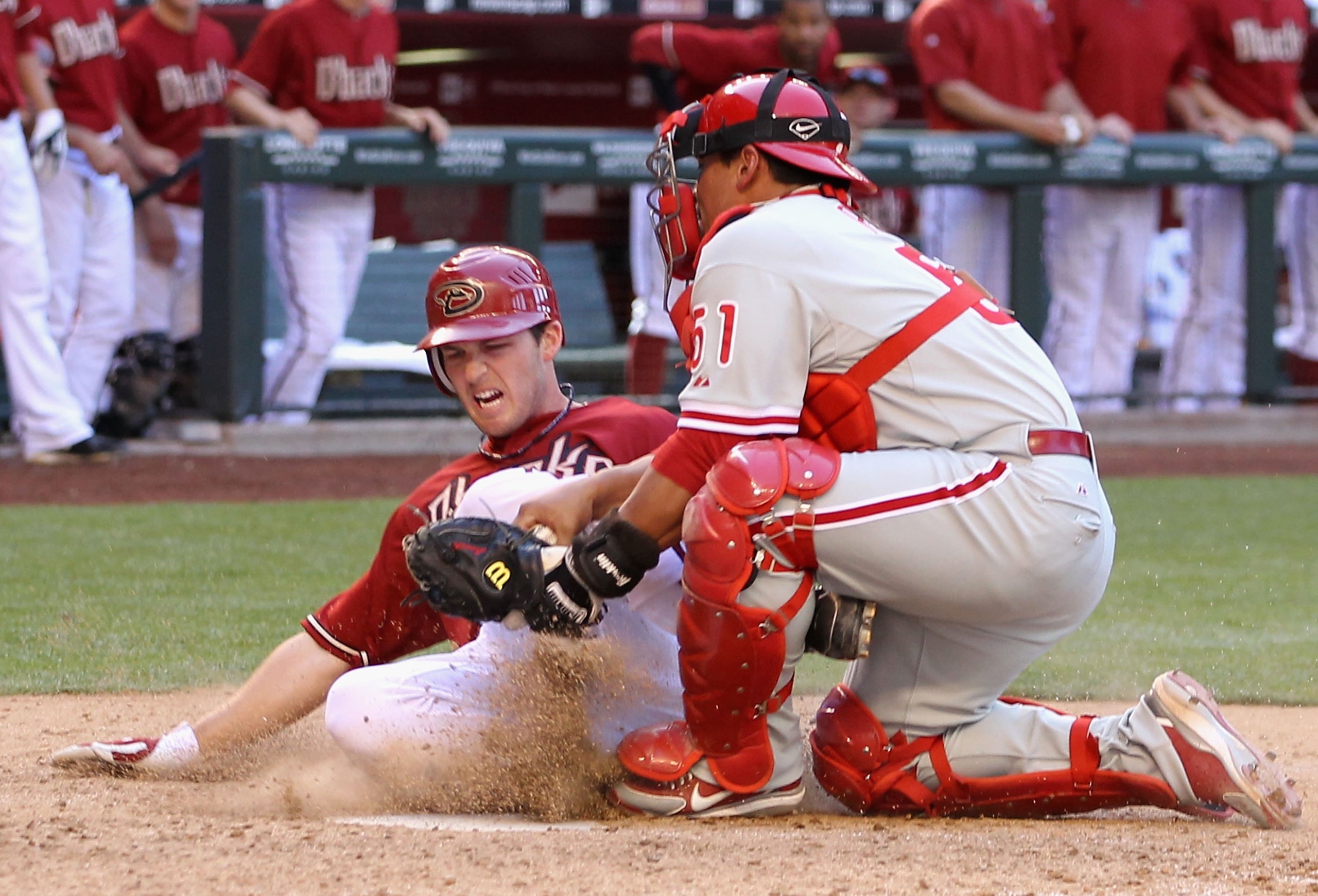 PHOENIX - APRIL 25:  Catcher Carlos Ruiz #51 of the Philadelphia Phillies tags out the sliding Stephen Drew #6 of the Arizona Diamondbacks at home plate during the eighth inning of the Major League Baseball game at Chase Field on April 25, 2010 in Phoenix
