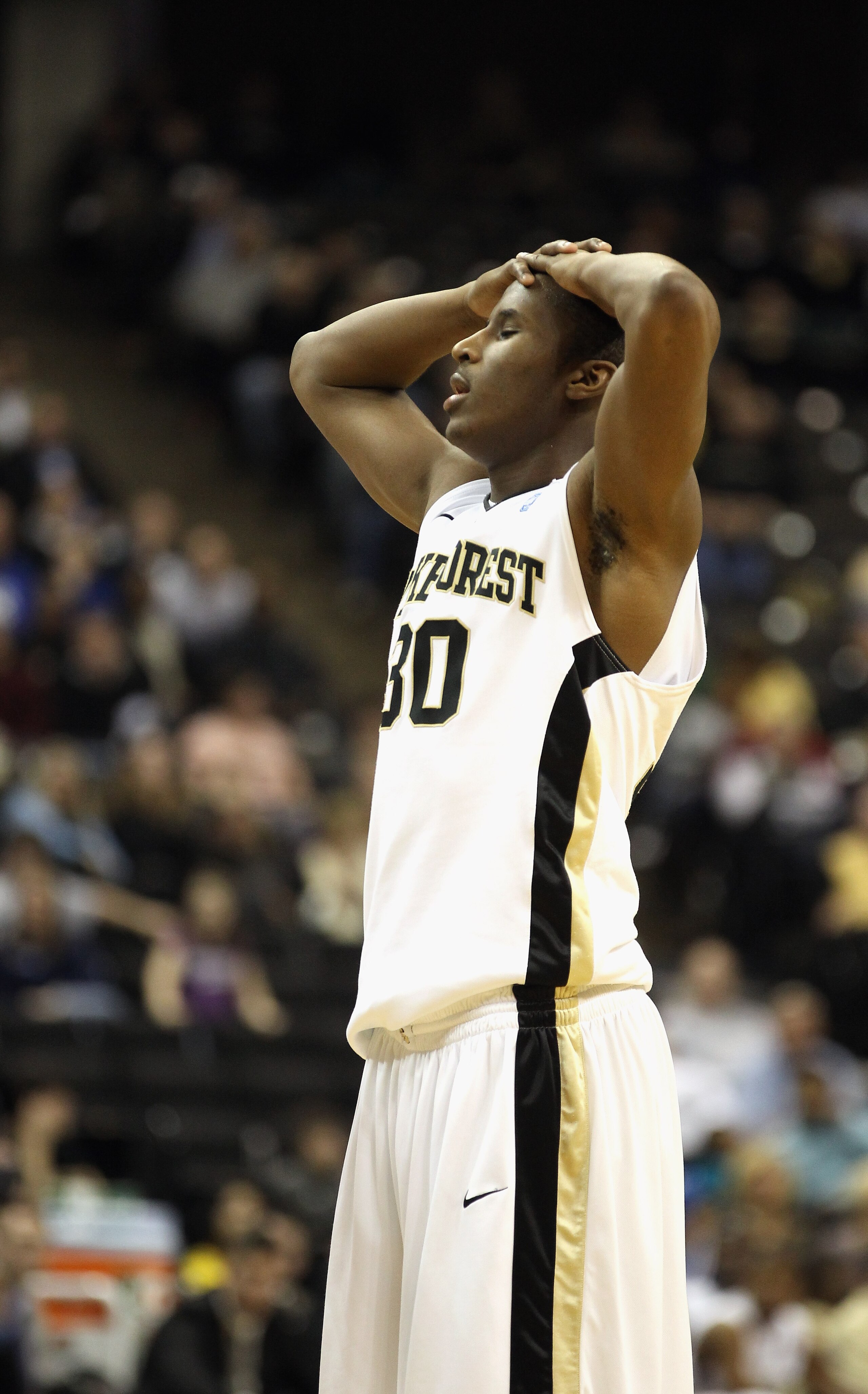 WINSTON SALEM, NC - JANUARY 22:  Travis McKie #30 of the Wake Forest Demon Deacons reacts to a call on his way to loosing to the Duke Blue Devils 83-59 at Lawrence Joel Coliseum on January 22, 2011 in Winston Salem, North Carolina.  (Photo by Streeter Lec