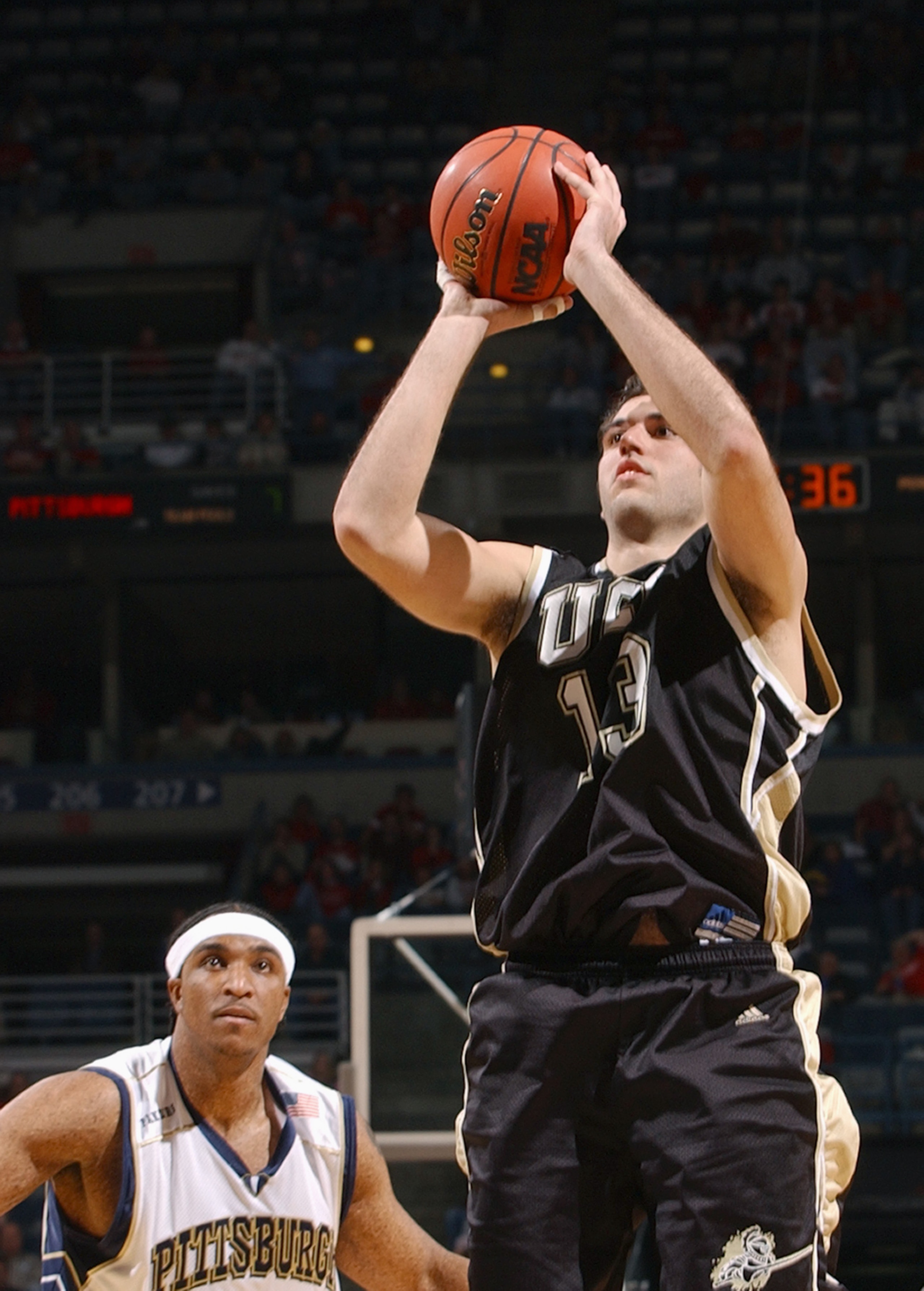 MILWAUKEE - MARCH 19:  Roberto Morentin #13 of the Central Florida Golden Knights takes a jump shot during the first round game of the NCAA Division I Men's Basketball Tournament against the Pittsburgh Panthers at Bradley Center on March 19, 2004 in Milwa