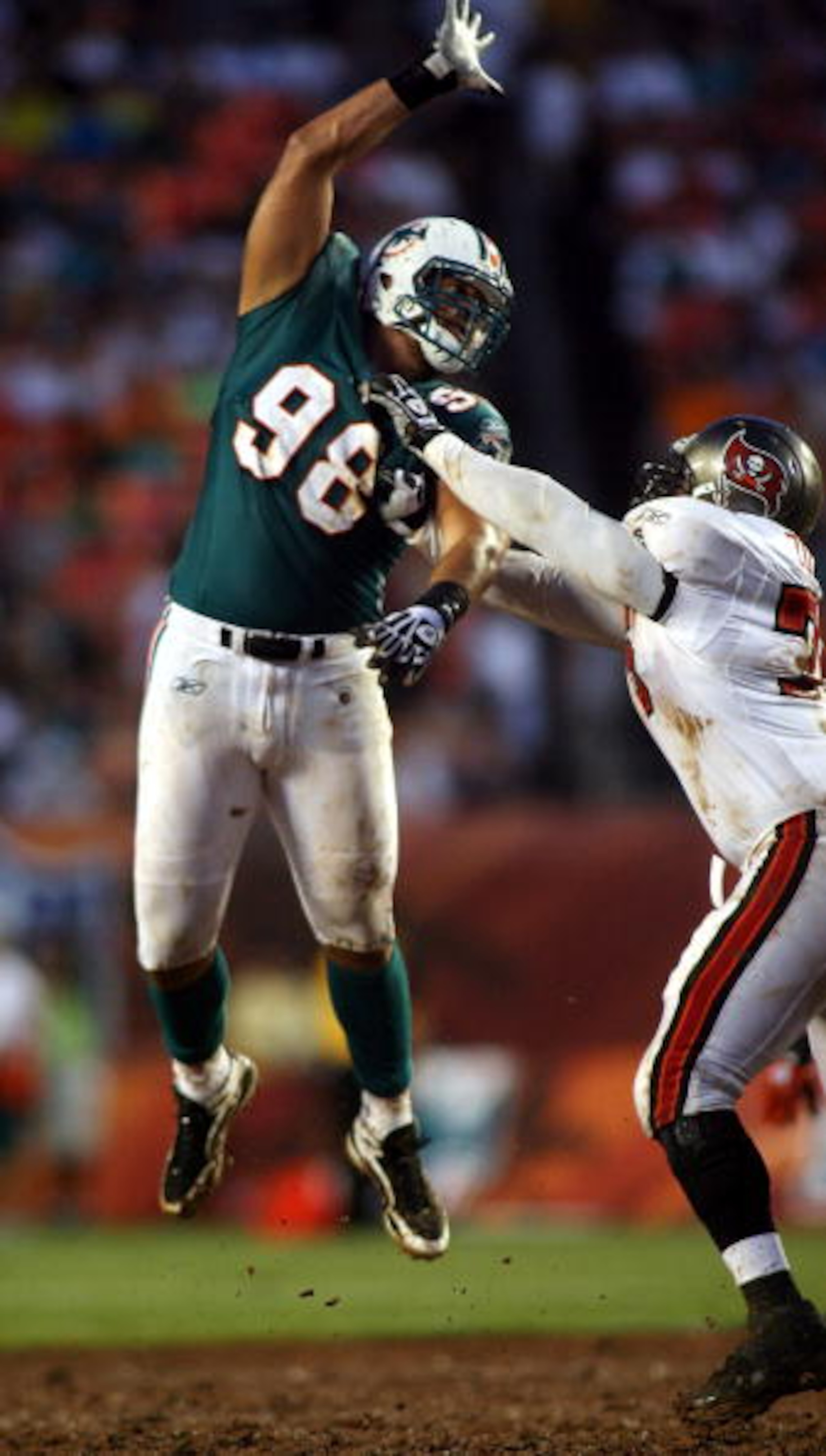 MIAMI - AUGUST 14:  Defensive end Jared Odrick #98 rushes against the Tampa Bay Buccaneers during the preseason game at Sun Life Stadium on August 14, 2010 in Miami, Florida.  (Photo by Marc Serota/Getty Images)
