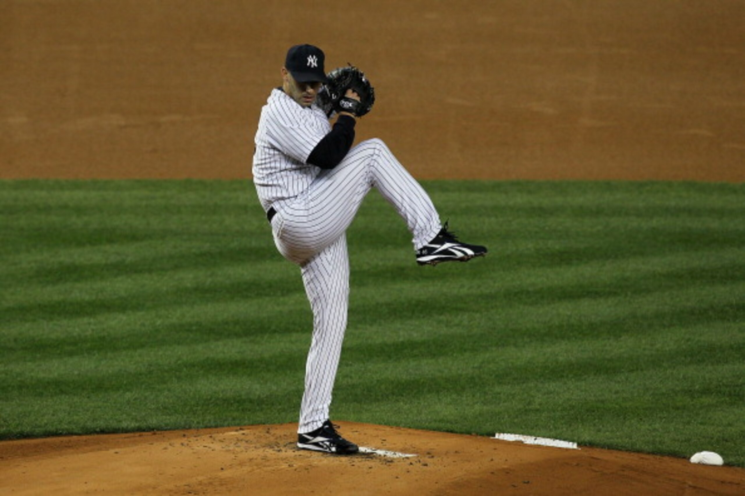 NEW YORK - OCTOBER 18:  Starting pitcher Andy Pettitte #46 of the New York Yankees pitches against the Texas Rangers in Game Three of the ALCS during the 2010 MLB Playoffs at Yankee Stadium on October 18, 2010 in New York, New York. The Raners won 8-0.  (