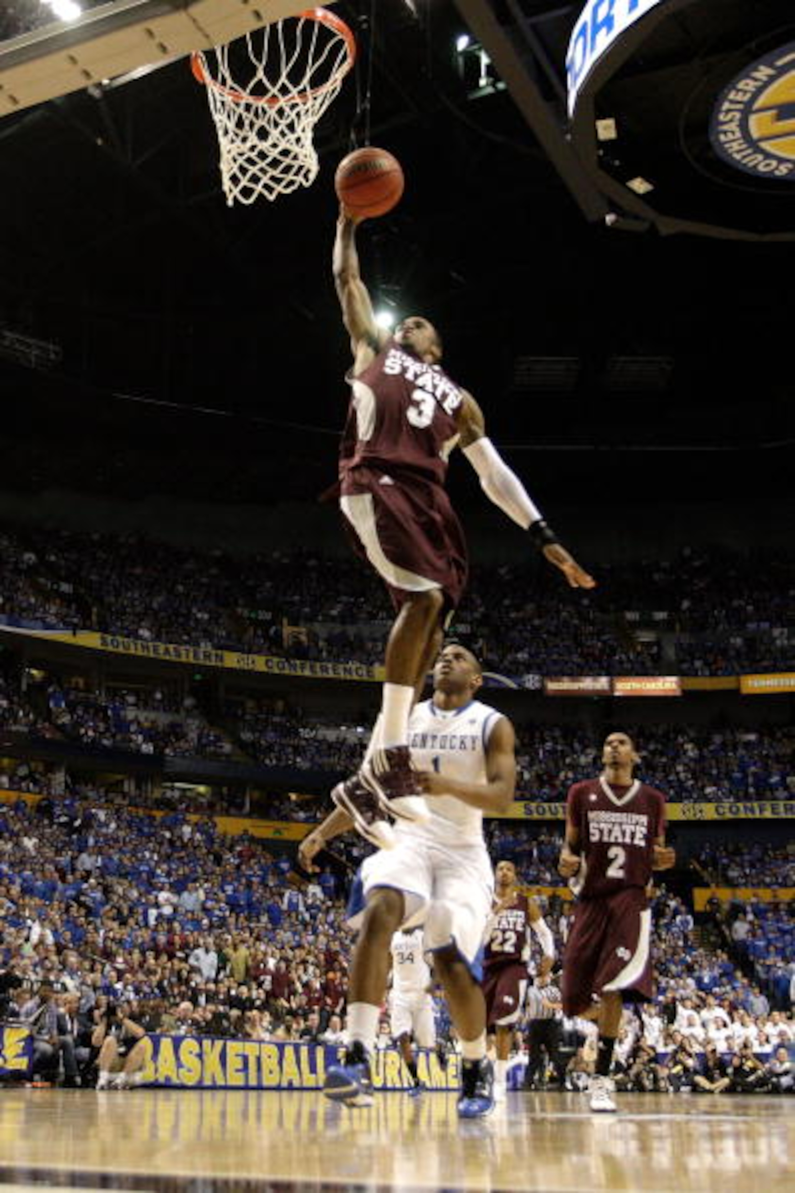 NASHVILLE, TN - MARCH 14:  Dee Bost #3 of the Mississippi State Bulldogs dunks against the Kentucky Wildcats during the final of the SEC Men's Basketball Tournament at the Bridgestone Arena on March 14, 2010 in Nashville, Tennessee. Kentucky won 75-74 in