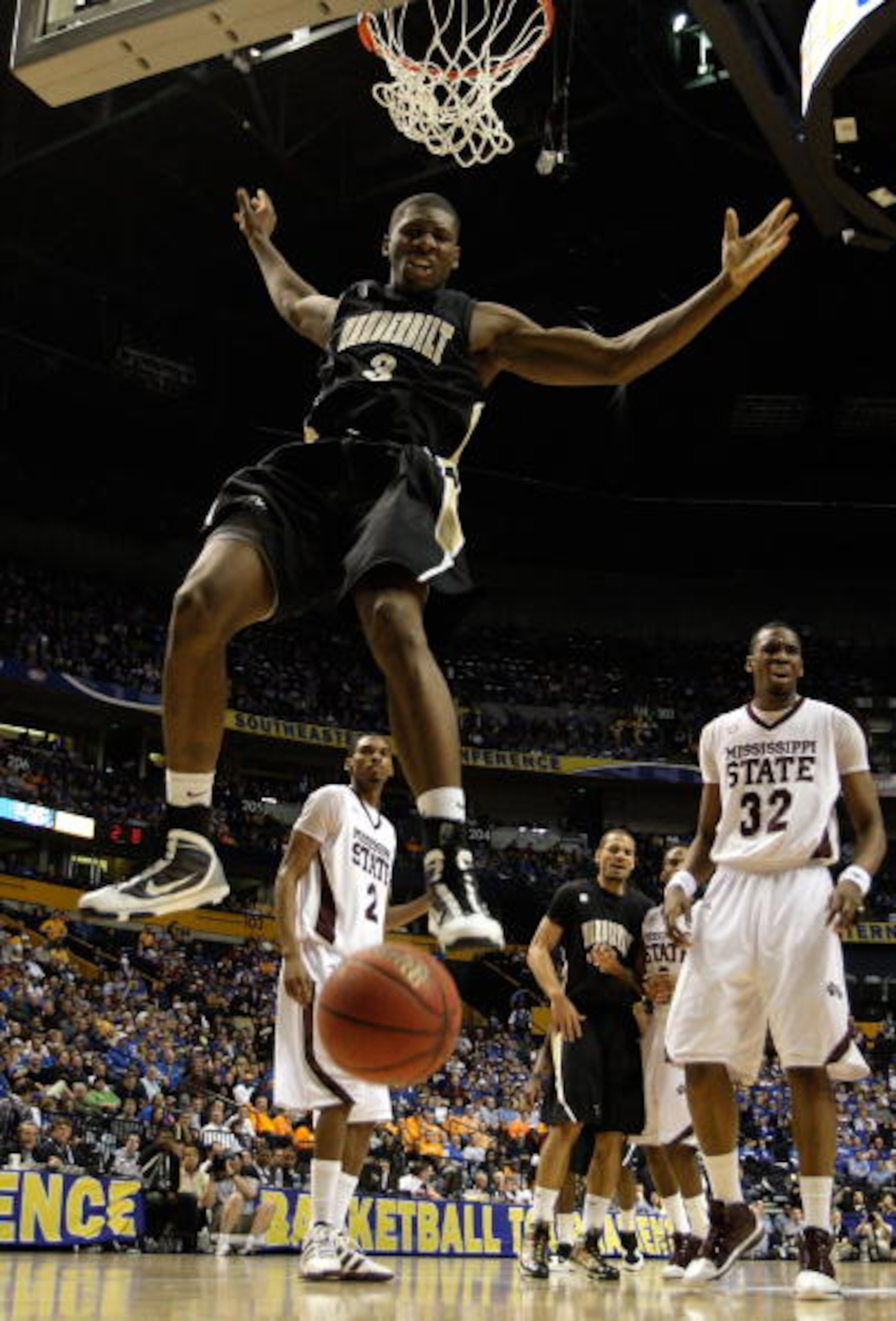 NASHVILLE, TN - MARCH 13:  Festus Ezeli #3 of the Vanderbilt Commodores dunks against the Mississippi State Bulldogs during the semifinals of the SEC Men's Basketball Tournament at the Bridgestone Arena on March 13, 2010 in Nashville, Tennessee. Mississip