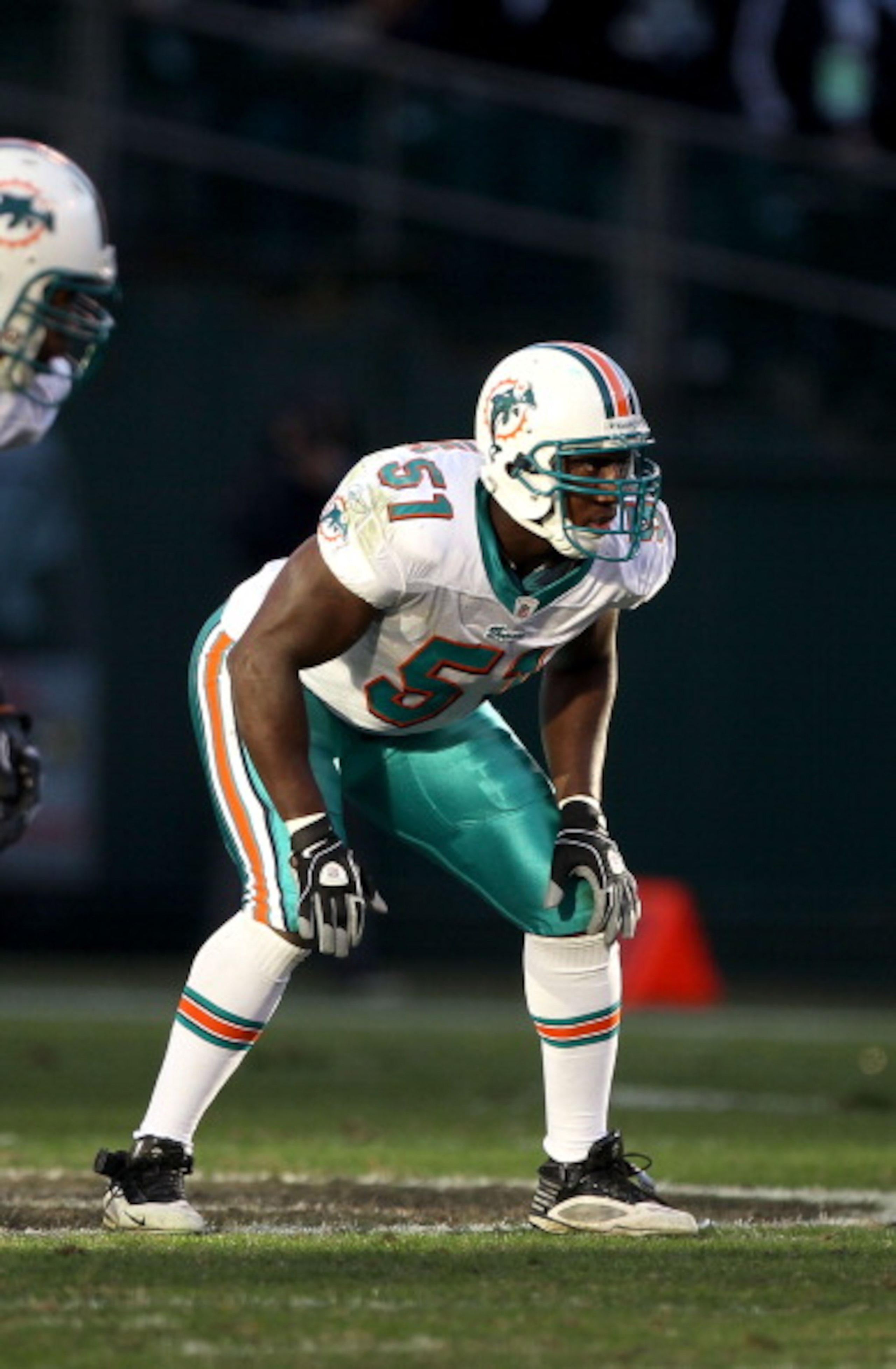 OAKLAND, CA - NOVEMBER 28:  Tim Dobbins #51 of the Miami Dolphins in action against the Oakland Raiders at Oakland-Alameda County Coliseum on November 28, 2010 in Oakland, California.  (Photo by Ezra Shaw/Getty Images)