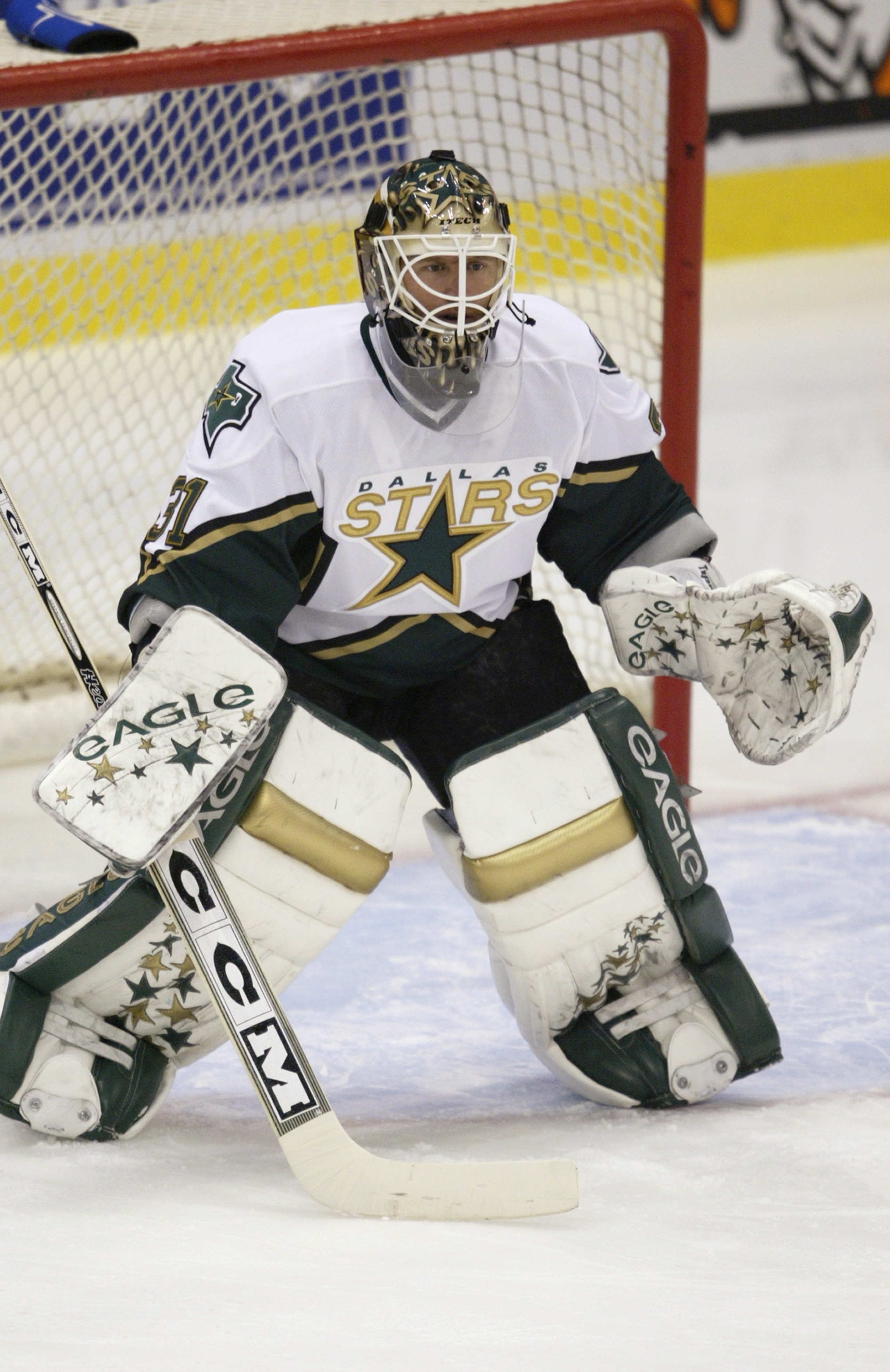 DETROIT - OCTOBER 24:  Goaltender Ron Tugnutt #31 of the Dallas Stars warms up in goal prior to taking on the Detroit Red Wings on October 24, 2003 at Joe Louis Arena in Detroit, Michigan. The Red Wings won the game 4-0. (Photo by Tom Pidgeon/Getty Images
