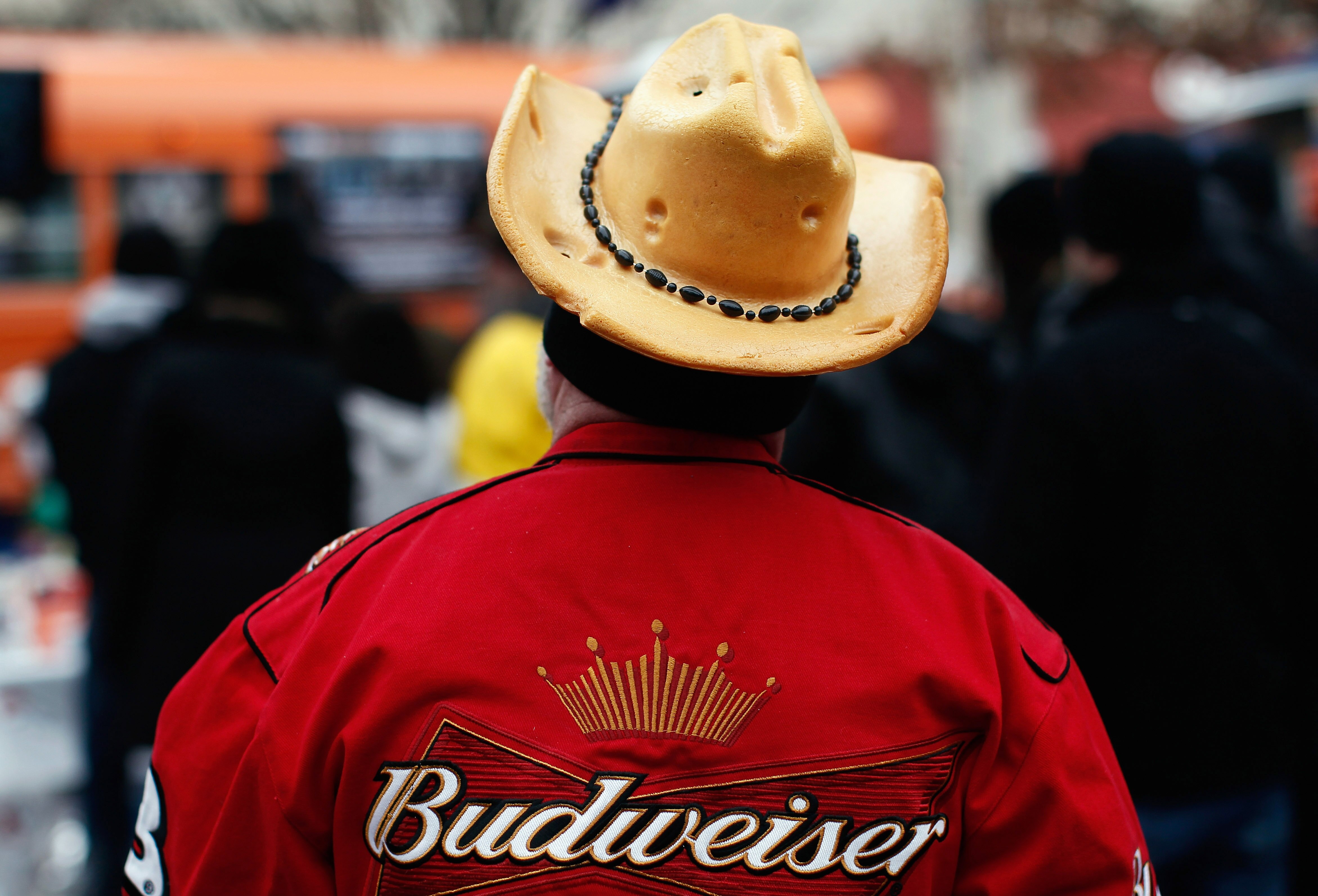 FORT WORTH, TX - FEBRUARY 03:  Fort Worth resident Ronnie Fountain wears a Green Bay Packers 'cheesehead' cowboy hat while touring Sundance Square with other fans February 3, 2011 in Fort Worth, Texas.  Super Bowl XLV will be played February 6, 2011 at Co