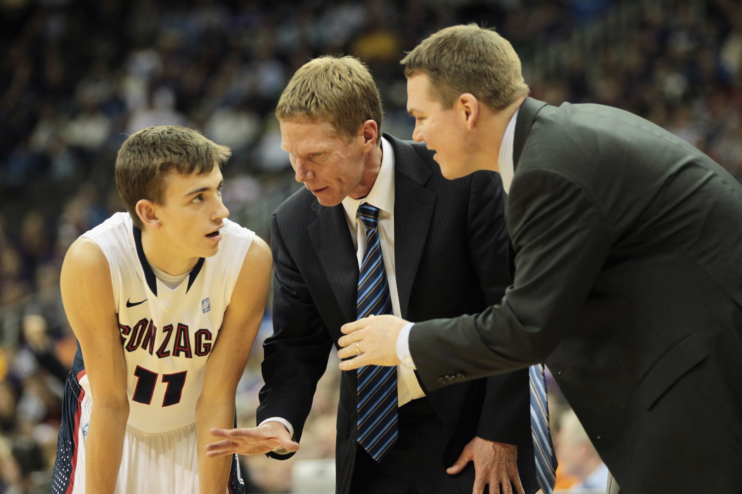 KANSAS CITY, MO - NOVEMBER 22:  David Stockton #11 the Gonzaga Bulldogs listes to head coach Mark Few during the CBE Classic game against the Kansas State Wildcats on November 22, 2010 at the Sprint Center in Kansas City, Missouri.  (Photo by Jamie Squire
