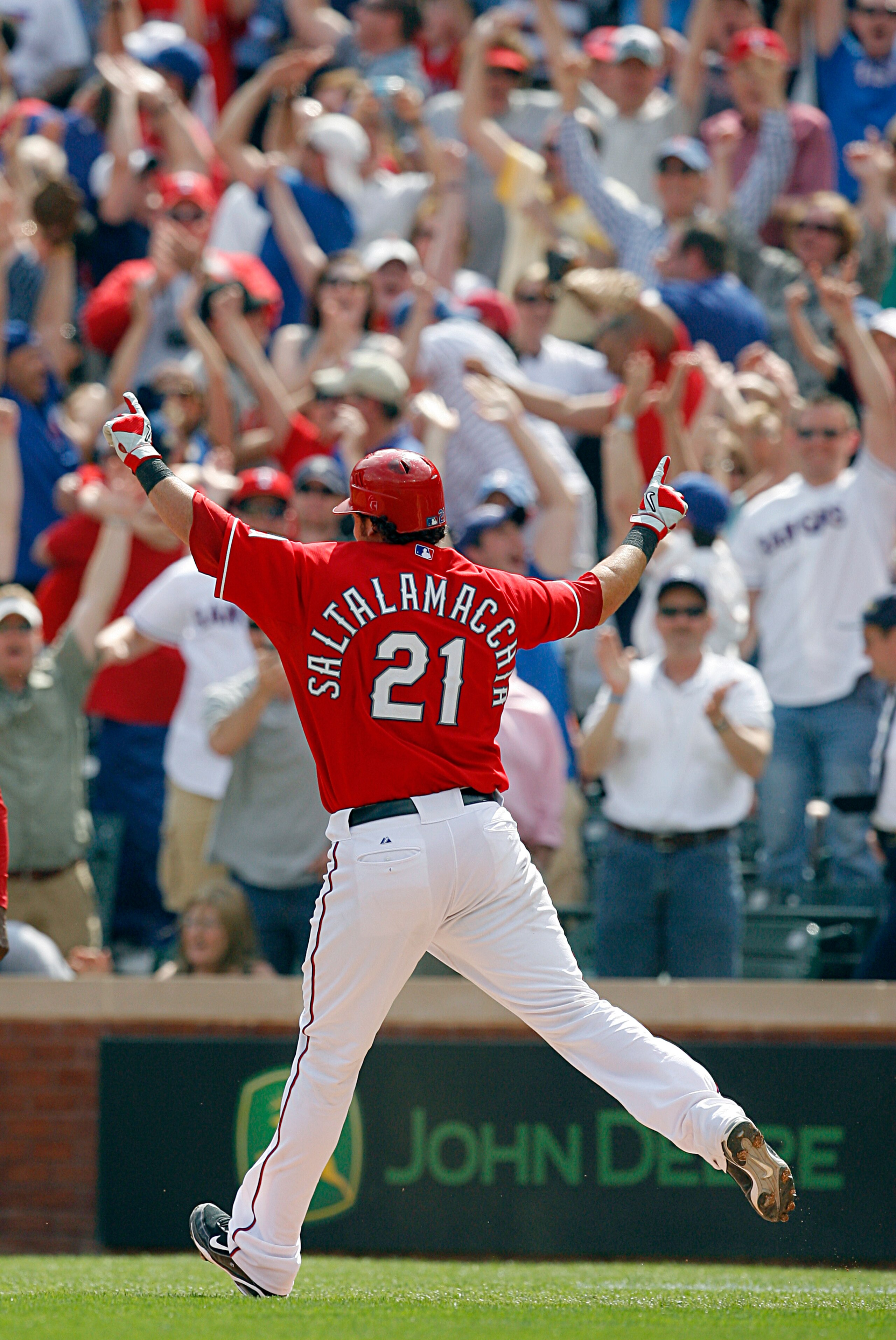 ARLINGTON, TX - APRIL 05:  Catcher Jarrod Saltalamacchia #21 of the Texas Rangers celebrates a walkoff RBI against the Toronto Blue Jays in the bottom of the ninth inning on Opening Day at Rangers Ballpark on April 5, 2010 in Arlington, Texas.  The Ranger
