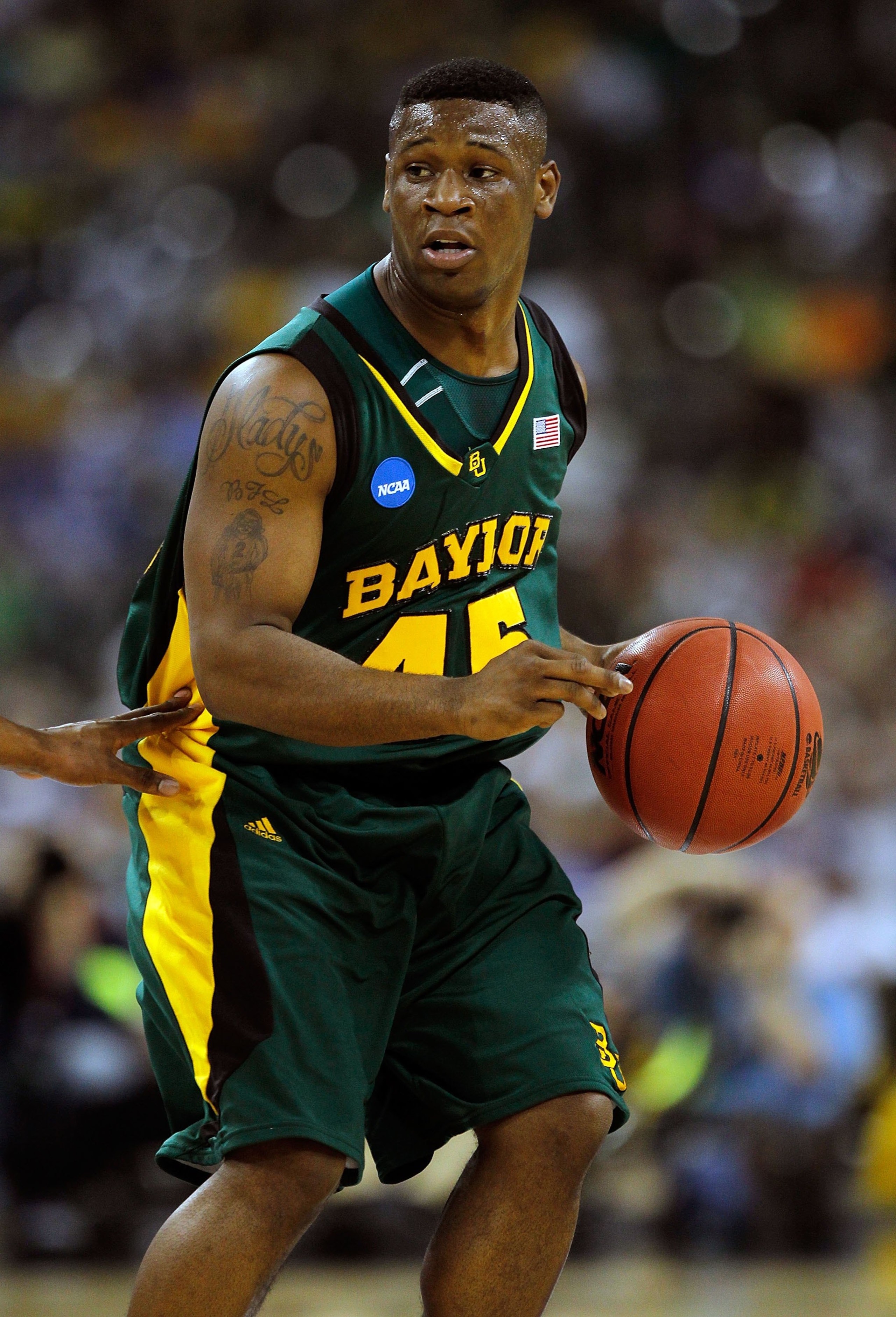 HOUSTON - MARCH 28: Tweety Carter #45 of the Baylor Bears brings the ball up court against the Duke Blue Devils during the south regional final of the 2010 NCAA men's basketball tournament at Reliant Stadium on March 28, 2010 in Houston, Texas. Duke defea