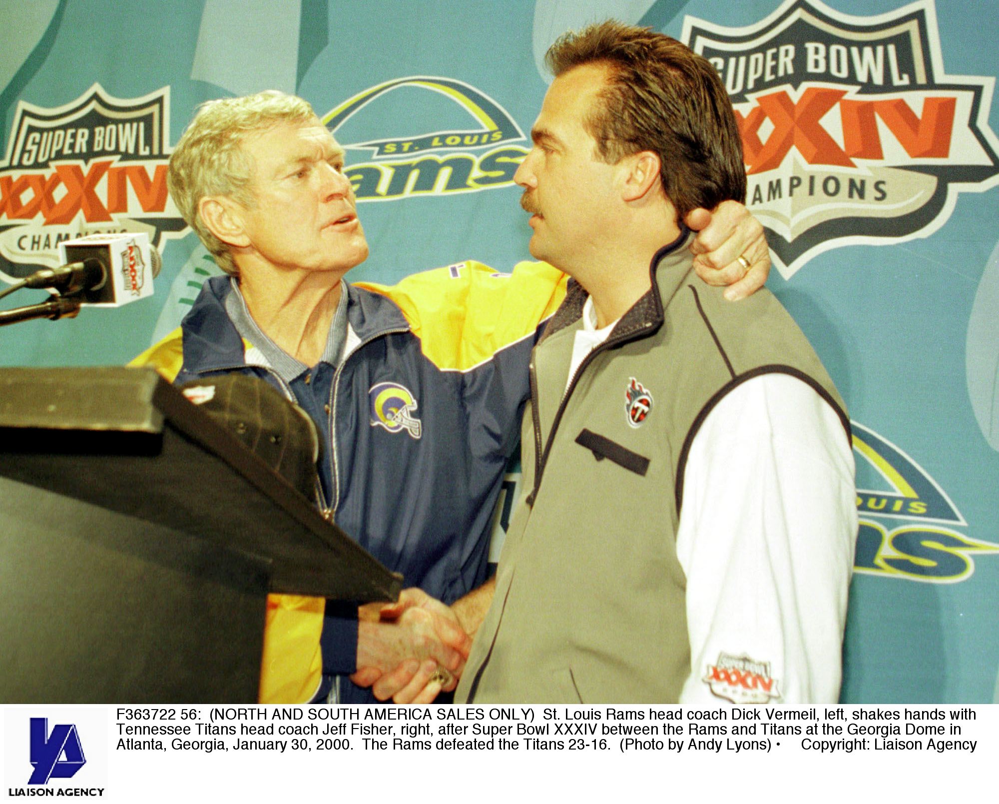 F363722 56: (NORTH AND SOUTH AMERICA SALES ONLY) St. Louis Rams head coach Dick Vermeil, left, shakes hands with Tennessee Titans head coach Jeff Fisher, right, after Super Bowl XXXIV between the Rams and Titans at the Georgia Dome in Atlanta, Georgia, Ja