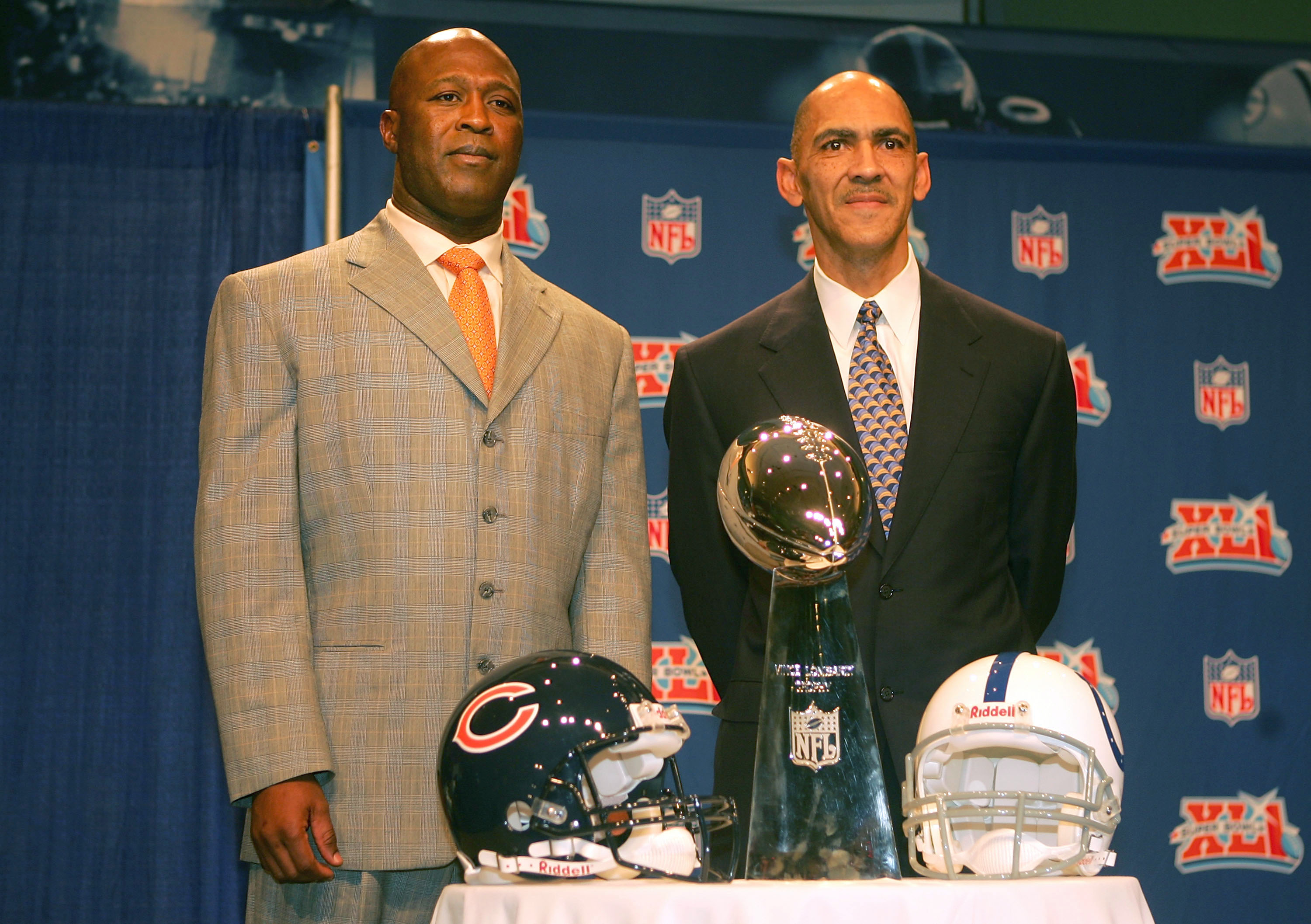 MIAMI - FEBRUARY 02:  (L-R) Head coaches, Lovie Smith of the Chicago Bears and Tony Dungy of the Indianapolis Colts pose together with the Super Bowl Trophy during a press conference at the Miami Beach Convention Center on February 2, 2007 in Miami, Flori
