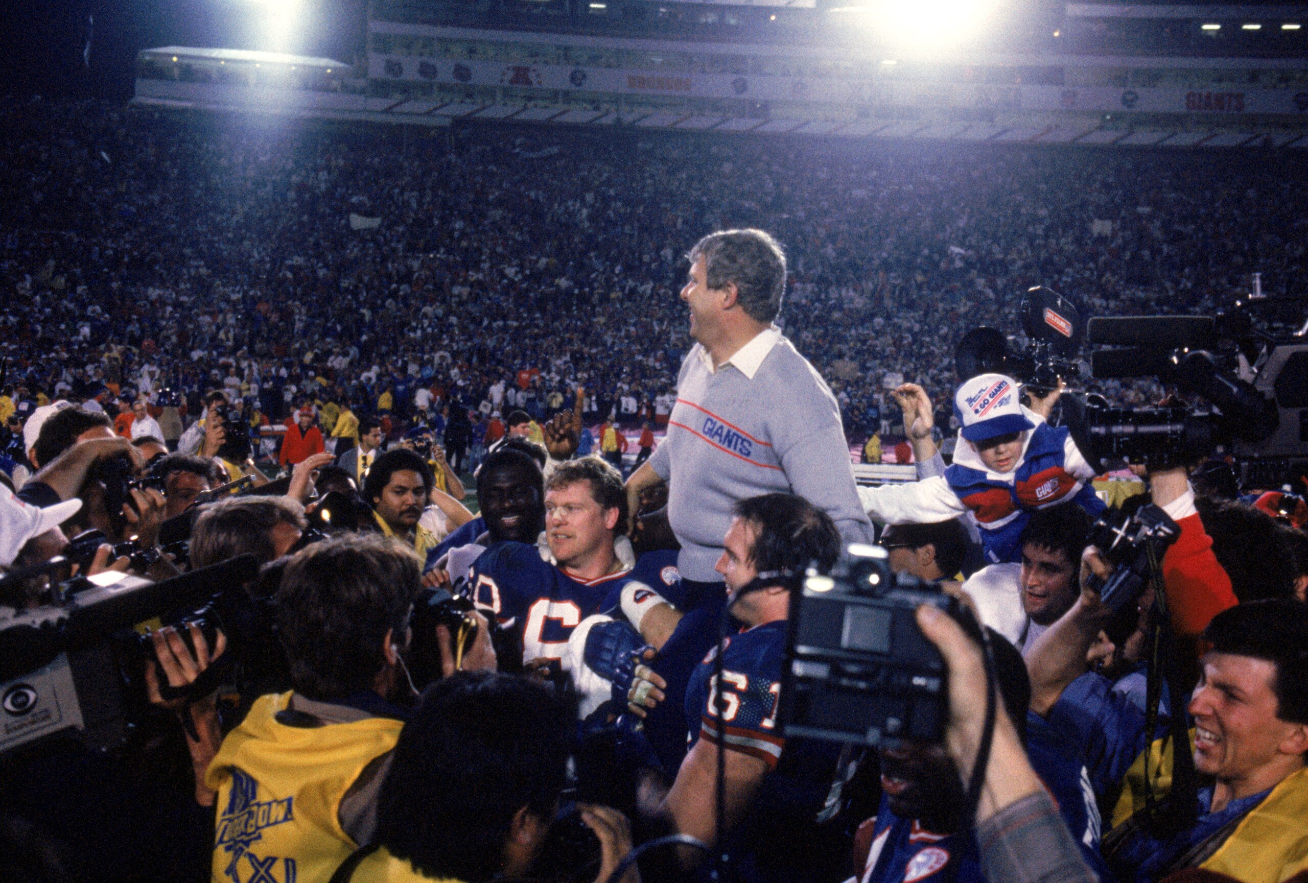 PASADENA, CA - JANUARY 25:  Head coach Bill Parcells of the New York Giants gets carried off the field following the game against the Denver Broncos during Super Bowl XXI at the Rose Bowl on January 25, 1987 in Pasadena, California. The Giants defeated th