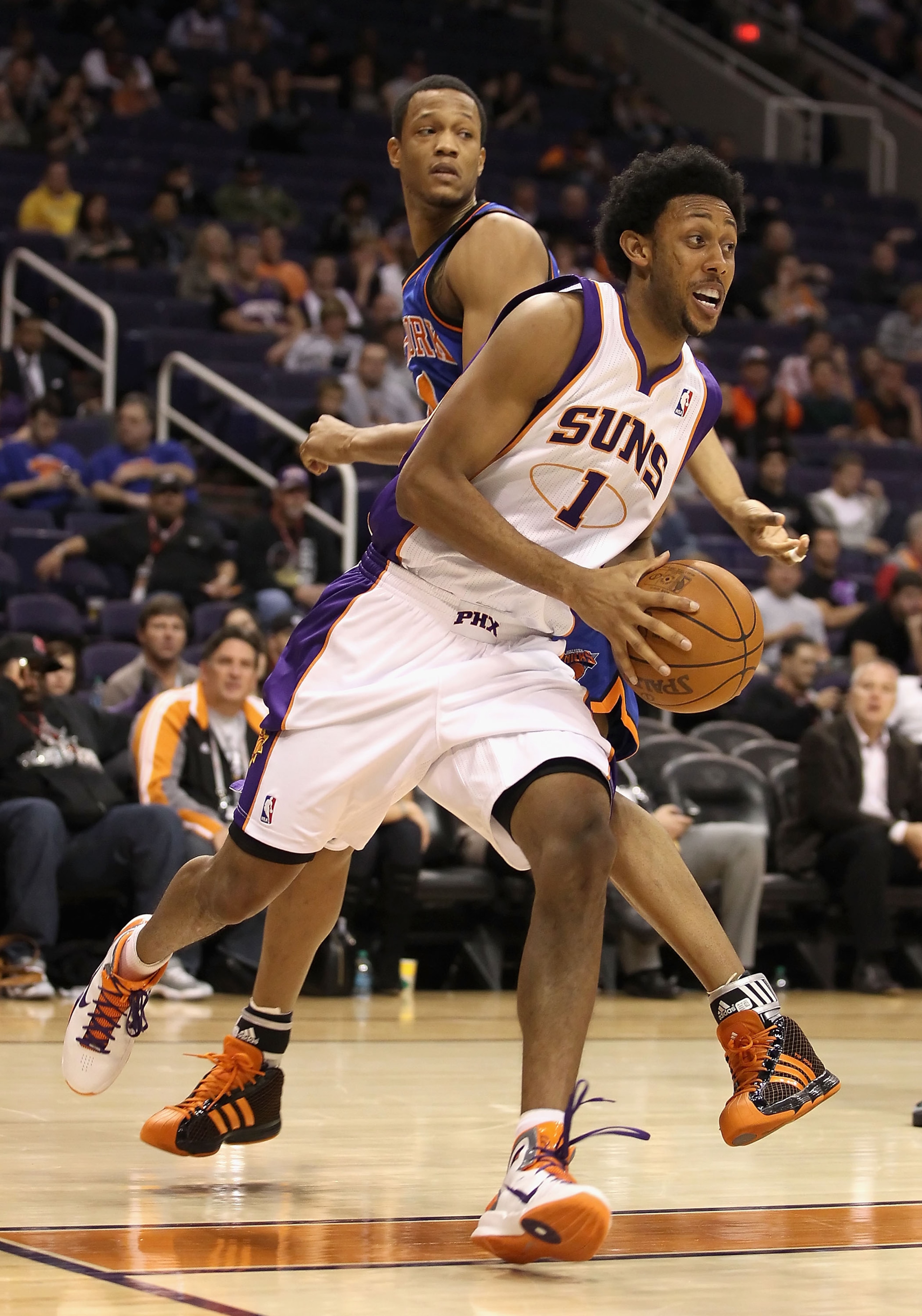 PHOENIX, AZ - JANUARY 07:  Josh Childress #1 of the Phoenix Suns drives the ball during the NBA game against the New York Knicks at US Airways Center on January 7, 2011 in Phoenix, Arizona.  The Knicks defeated the Suns 121-96.  NOTE TO USER: User express