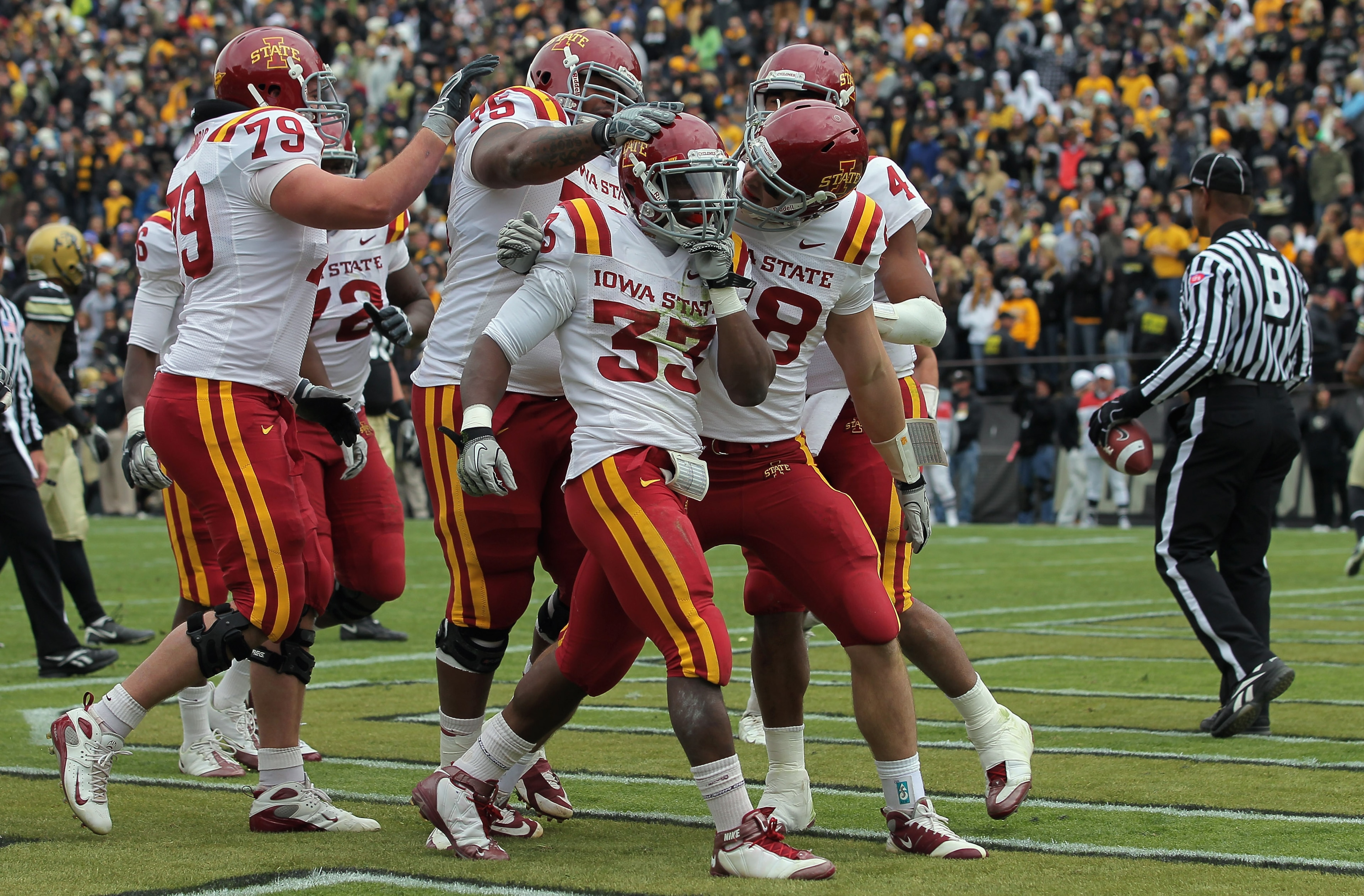 BOULDER, CO - NOVEMBER 13: Alexander Robinson #33 of the Iowa State Cyclones celebrates his eight yard touchdown run in the second quarter with his teammates against the Colorado Buffaloes at Folsom Field on November 13, 2010 in Boulder, Colorado. Colora BOULDER, CO - NOVEMBER 13: Alexander Robinson #33 of the Iowa State Cyclones celebrates his eight yard touchdown run in the second quarter with his teammates against the Colorado Buffaloes at Folsom Field on November 13, 2010 in Boulder, Colorado. Colora