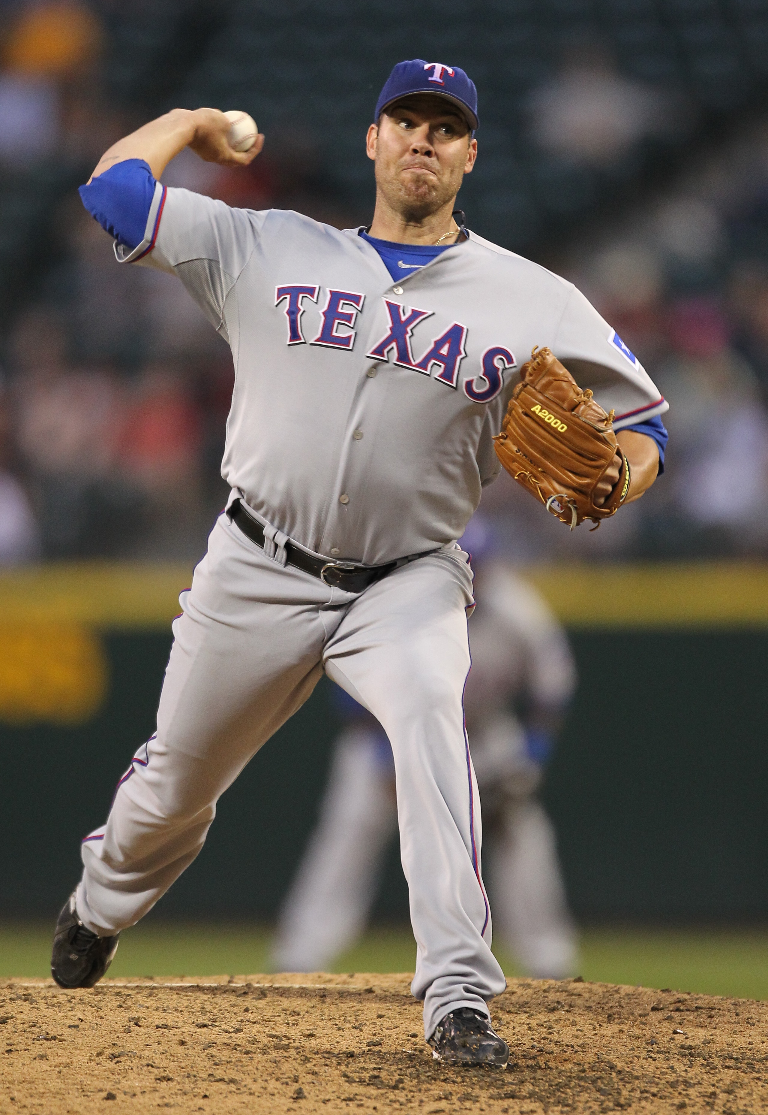 SEATTLE - AUGUST 03:  Starter Colby Lewis #48 of the Texas Rangers pitches against the Seattle Mariners at Safeco Field on August 3, 2010 in Seattle, Washington. (Photo by Otto Greule Jr/Getty Images)