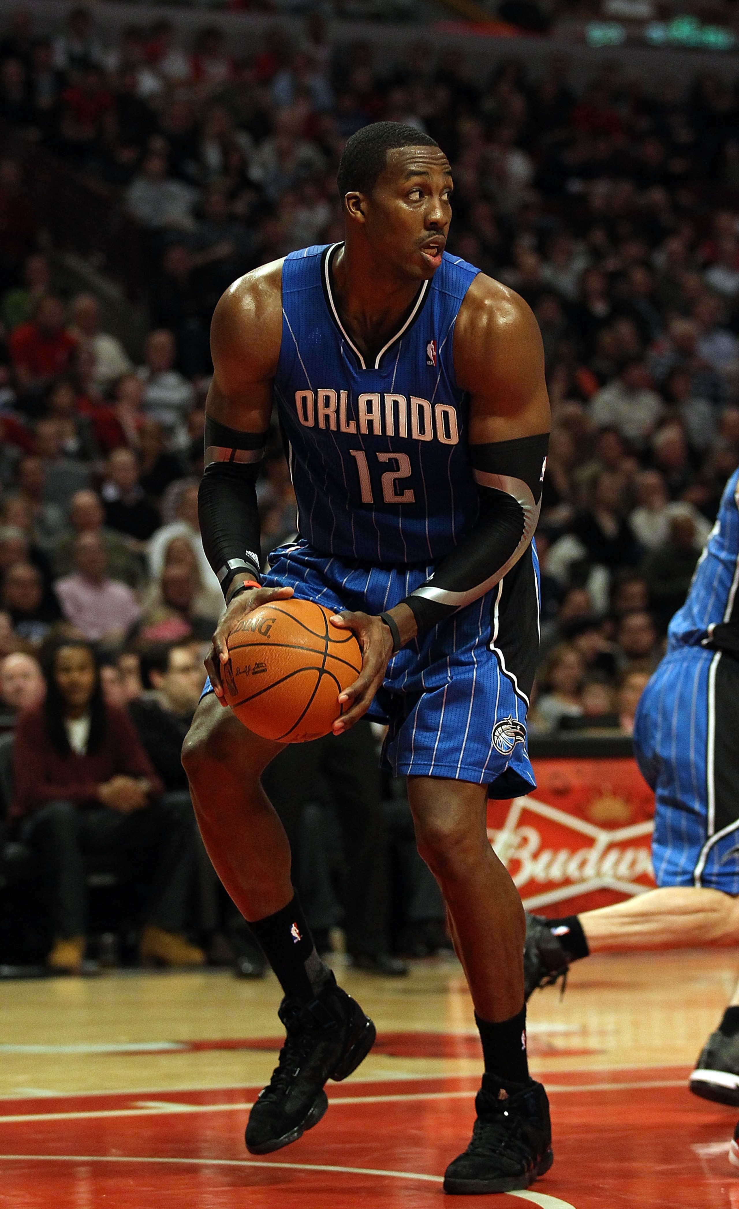 CHICAGO, IL - JANUARY 28: Dwight Howard #12 of the Orlando Magic looks to pass after grabbing a rebound against the Chicago Bulls at the United Center on January 28, 2011 in Chicago, Illinois. The Bulls defeated the Magic 99-90. NOTE TO USER: User express
