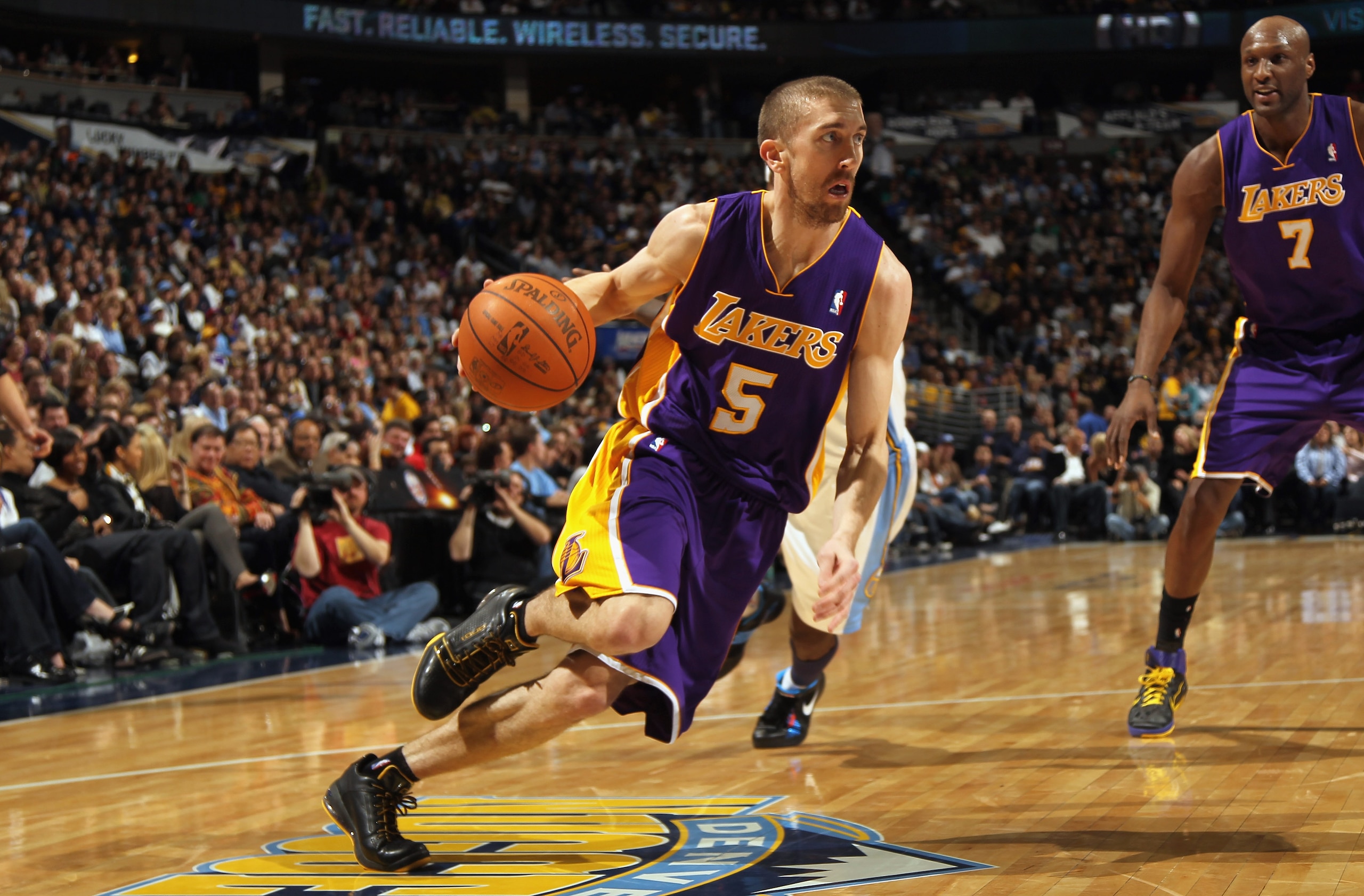 DENVER, CO - JANUARY 21:  Steve Blake #5 of the Los Angeles Lakers drives to the basket against the Denver Nuggets at the Pepsi Center on January 21, 2011 in Denver, Colorado. NOTE TO USER: User expressly acknowledges and agrees that, by downloading and o