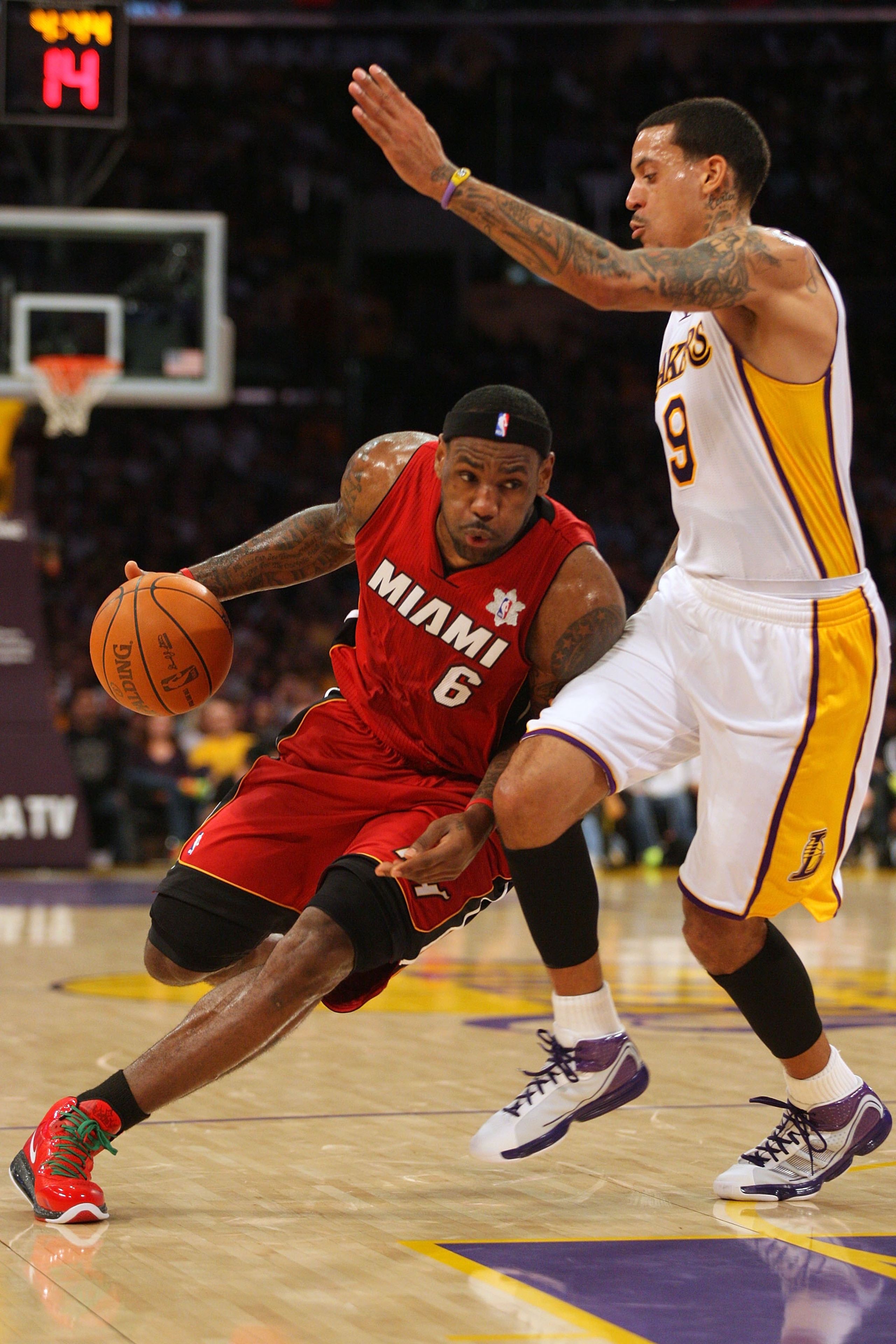 LOS ANGELES, CA - DECEMBER 25: LeBron James #6 of the Miami Heat dribble drives to the basket against Matt Barnes #9 of the Los Angeles Lakers during the NBA game at Staples Center on December 25, 2010 in Los Angeles, California. (Photo by Victor Decolong