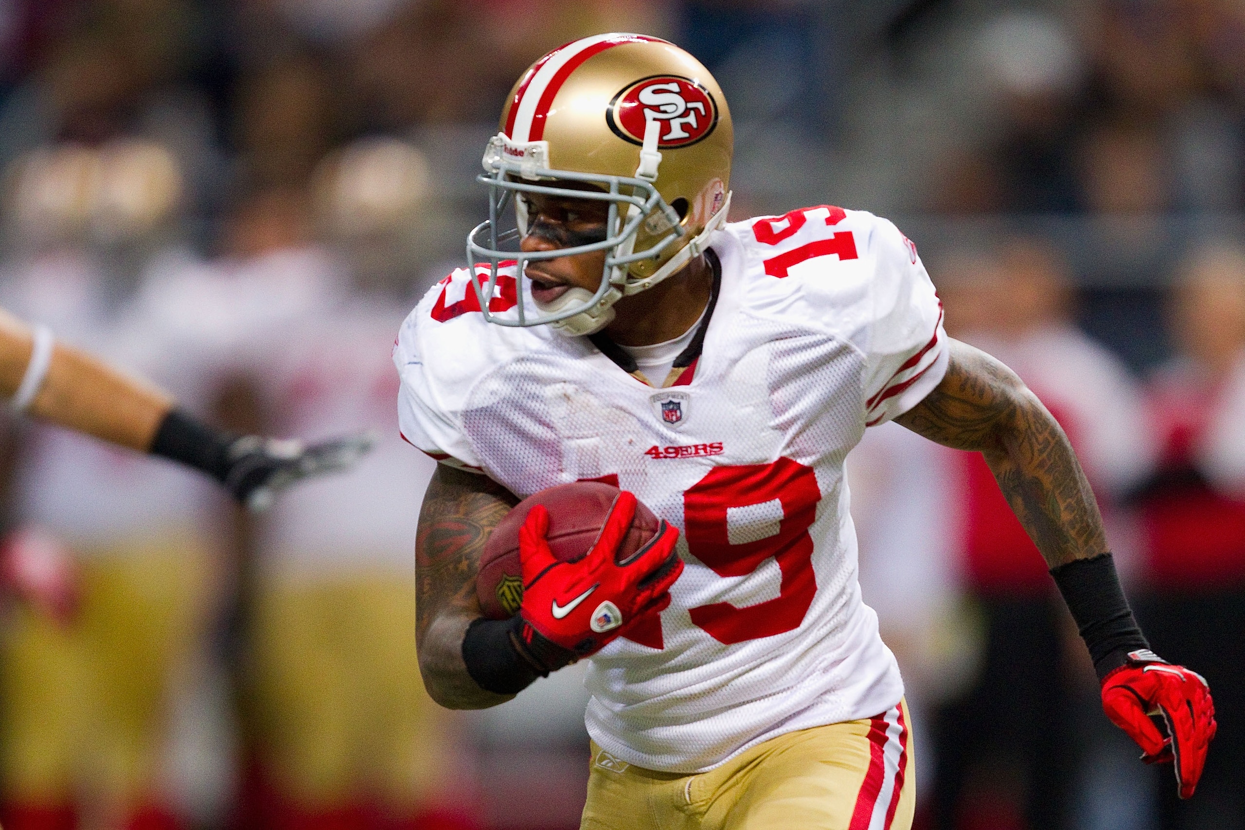 ST. LOUIS, MO - DECEMBER 26: Ted Ginn #19 of the San Francisco 49ers returns a kick off against the St. Louis Rams at the Edward Jones Dome on December 26, 2010 in St. Louis, Missouri. The Rams beat the 49ers 25-17. (Photo by Dilip Vishwanat/Getty Images)