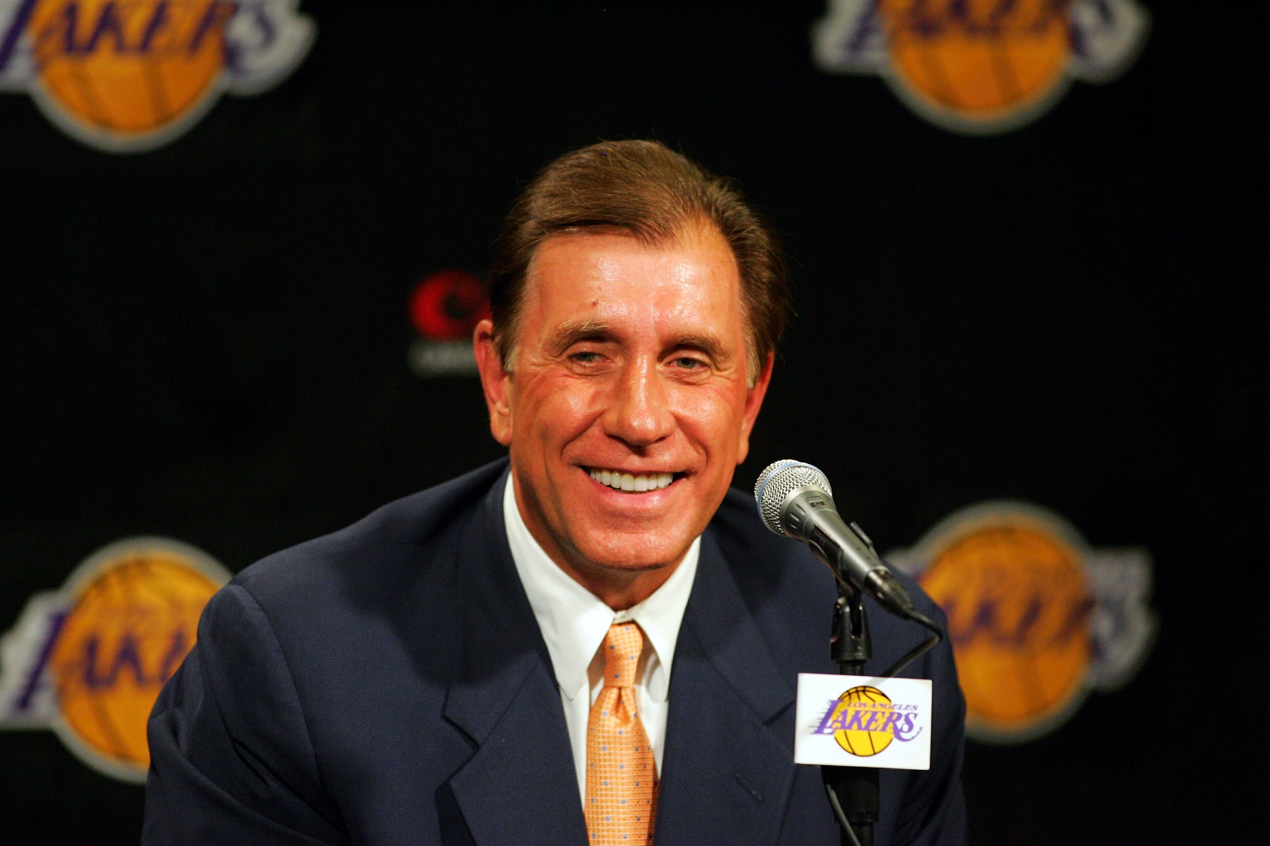 LOS ANGELES - JULY 10: Rudy Tomjanovich smiles during a press conference announcing him as the new head coach of the Los Angeles Lakers on July 10, 2004 at the Staples Center in Los Angeles, California.  (Photo by Ronald Martinez/Getty Images)