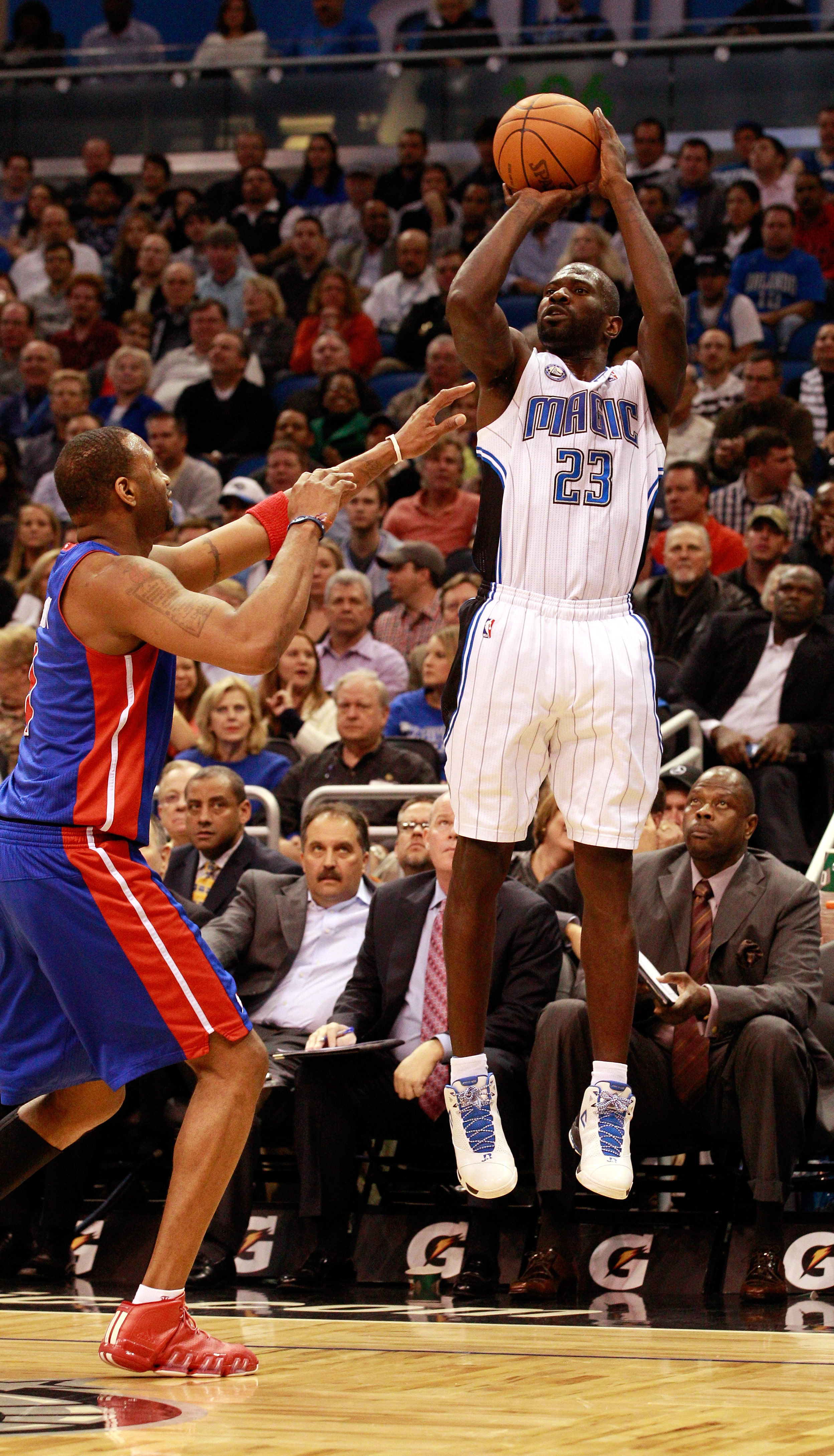 ORLANDO, FL - JANUARY 24:  Jason Richardson #23 of the Orlando Magic attempts a shot over Tracy McGrady #1 of the Detroit Pistons during the game at Amway Arena on January 24, 2011 in Orlando, Florida.  NOTE TO USER: User expressly acknowledges and agrees