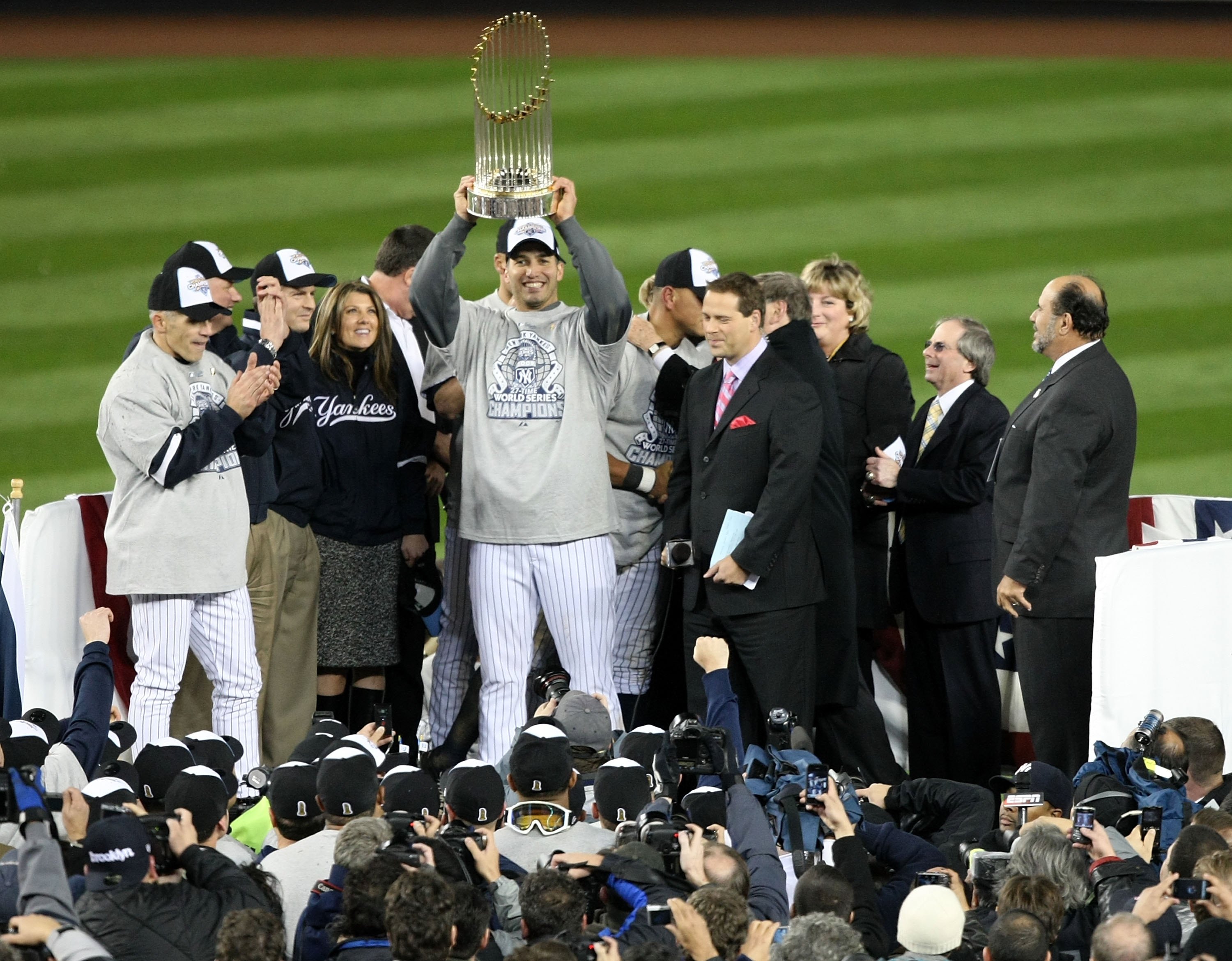 NEW YORK - NOVEMBER 04:  Andy Pettitte #46 of the New York Yankees celebrates with the trophy after their 7-3 win against the Philadelphia Phillies in Game Six of the 2009 MLB World Series at Yankee Stadium on November 4, 2009 in the Bronx borough of New