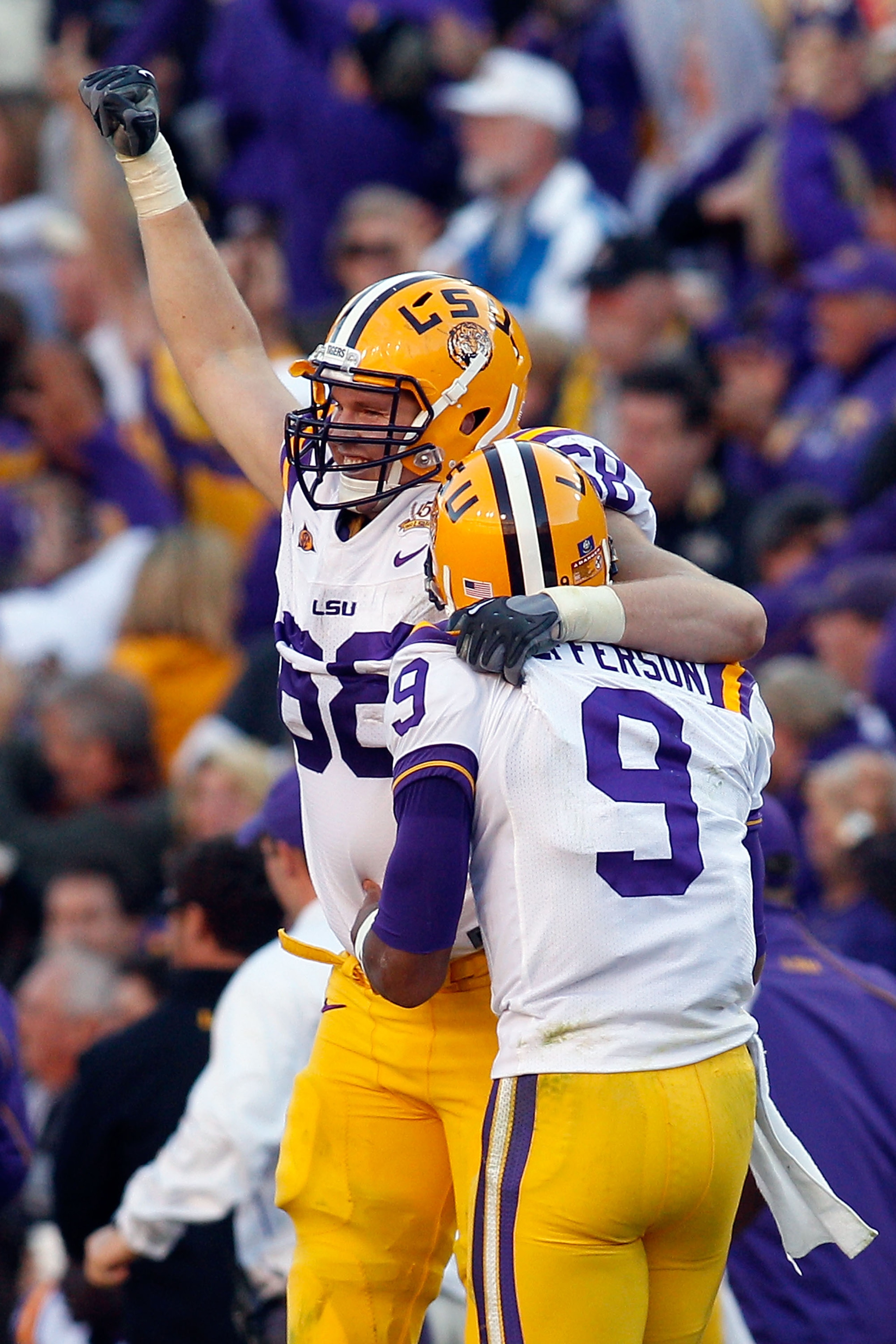 BATON ROUGE, LA - NOVEMBER 06:  Josh Dworaczyk #68 and Jordan Jefferson #9 of the Louisiana State University Tigers celebrate after scoring a touchdown against the Alabama Crimson Tide at Tiger Stadium on November 6, 2010 in Baton Rouge, Louisiana. The Ti