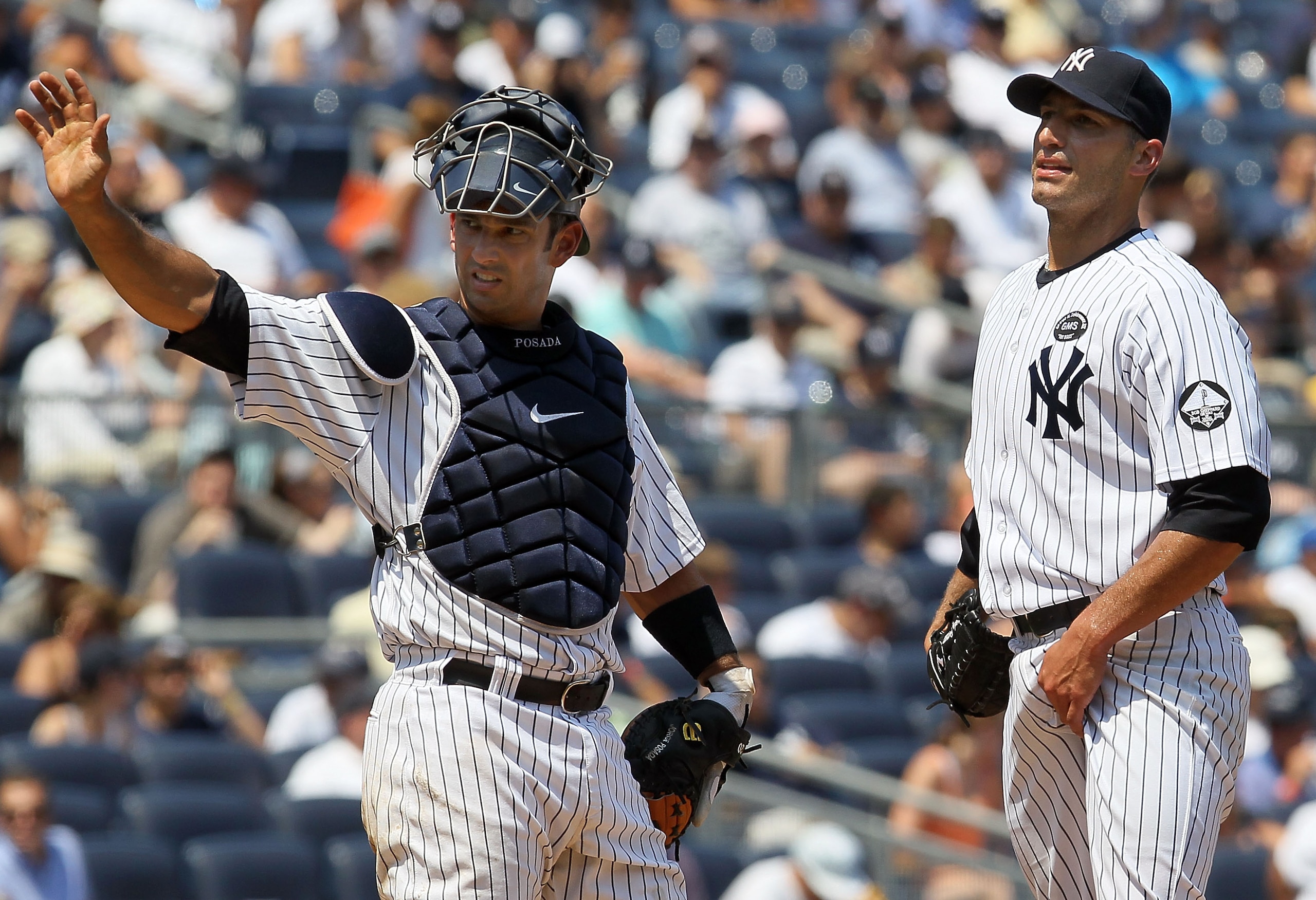 NEW YORK - JULY 18:  Andy Pettitte #46 of the New York Yankees looks on prior to leaving the game in the third inning against the Tampa Bay Rays as teammate Jorge Posada #20 calls for the trainer on July 18, 2010 at Yankee Stadium in the Bronx borough of