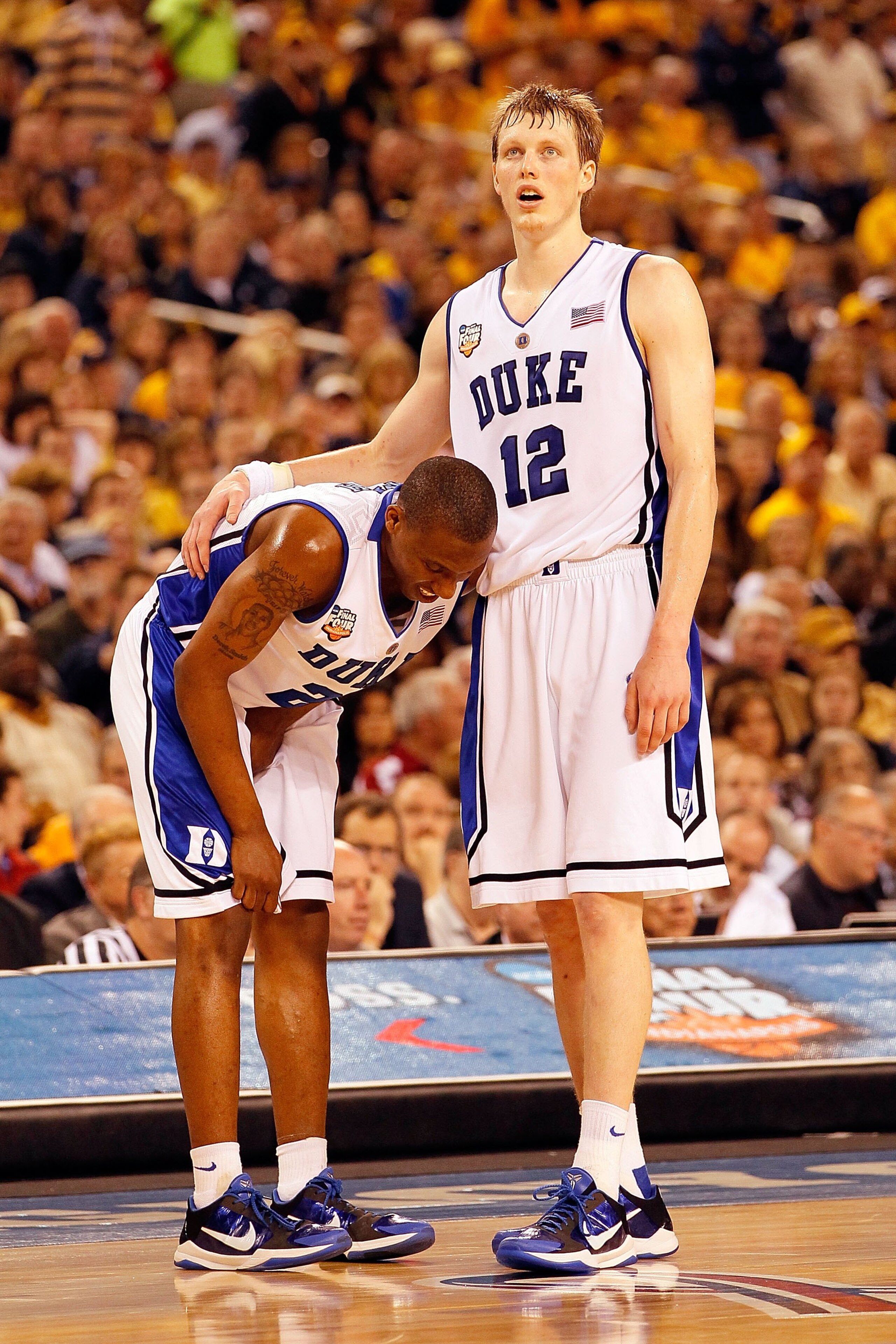 INDIANAPOLIS - APRIL 03:  Nolan Smith #2 of the Duke Blue Devils reacts with teammate Kyle Singler #12 before the Blue Devils defeated the West Virginia Mountaineers 78-57 during the National Semifinal game of the 2010 NCAA Division I Men's Basketball Cha