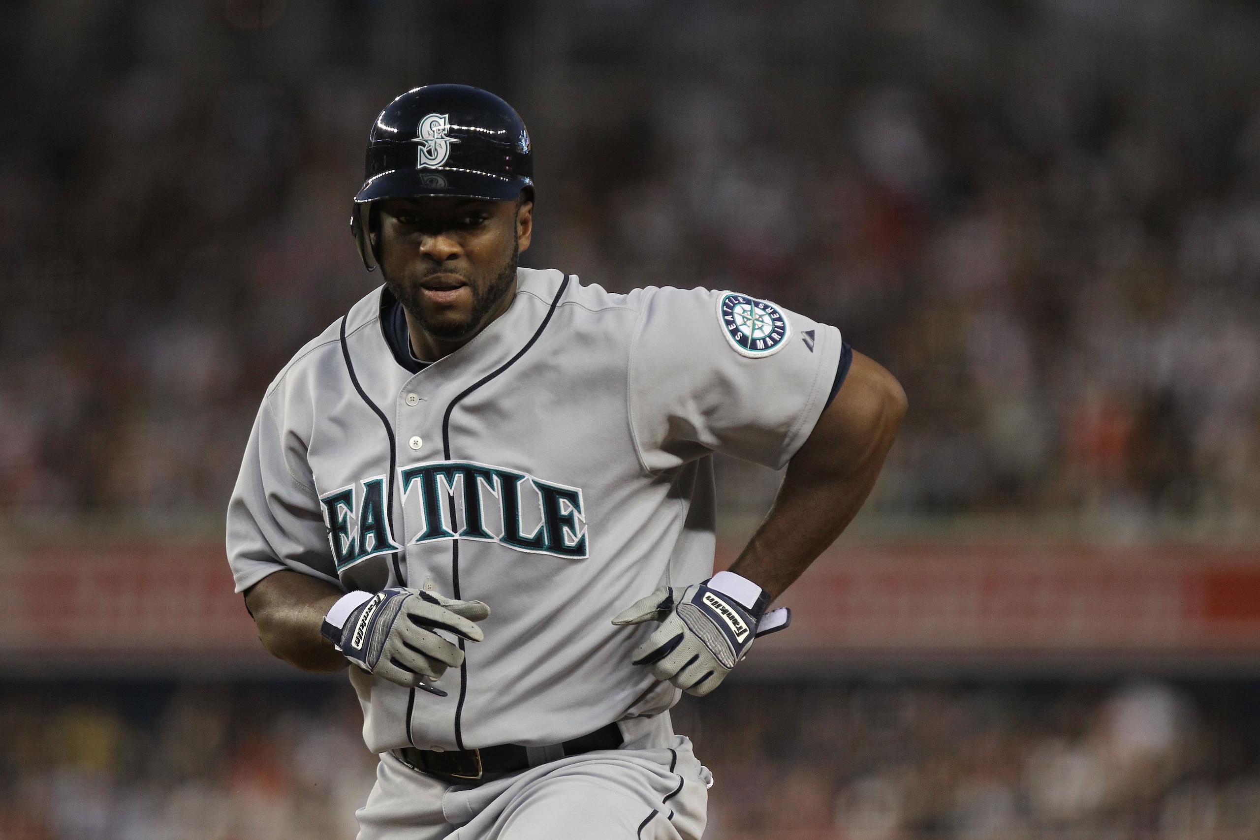 NEW YORK - JUNE 29:  Milton Bradley #15 of the Seattle Mariners runs back to first against the New York Yankees at Yankee Stadium on June 29, 2010 in the Bronx borough of New York City.  (Photo by Nick Laham/Getty Images)