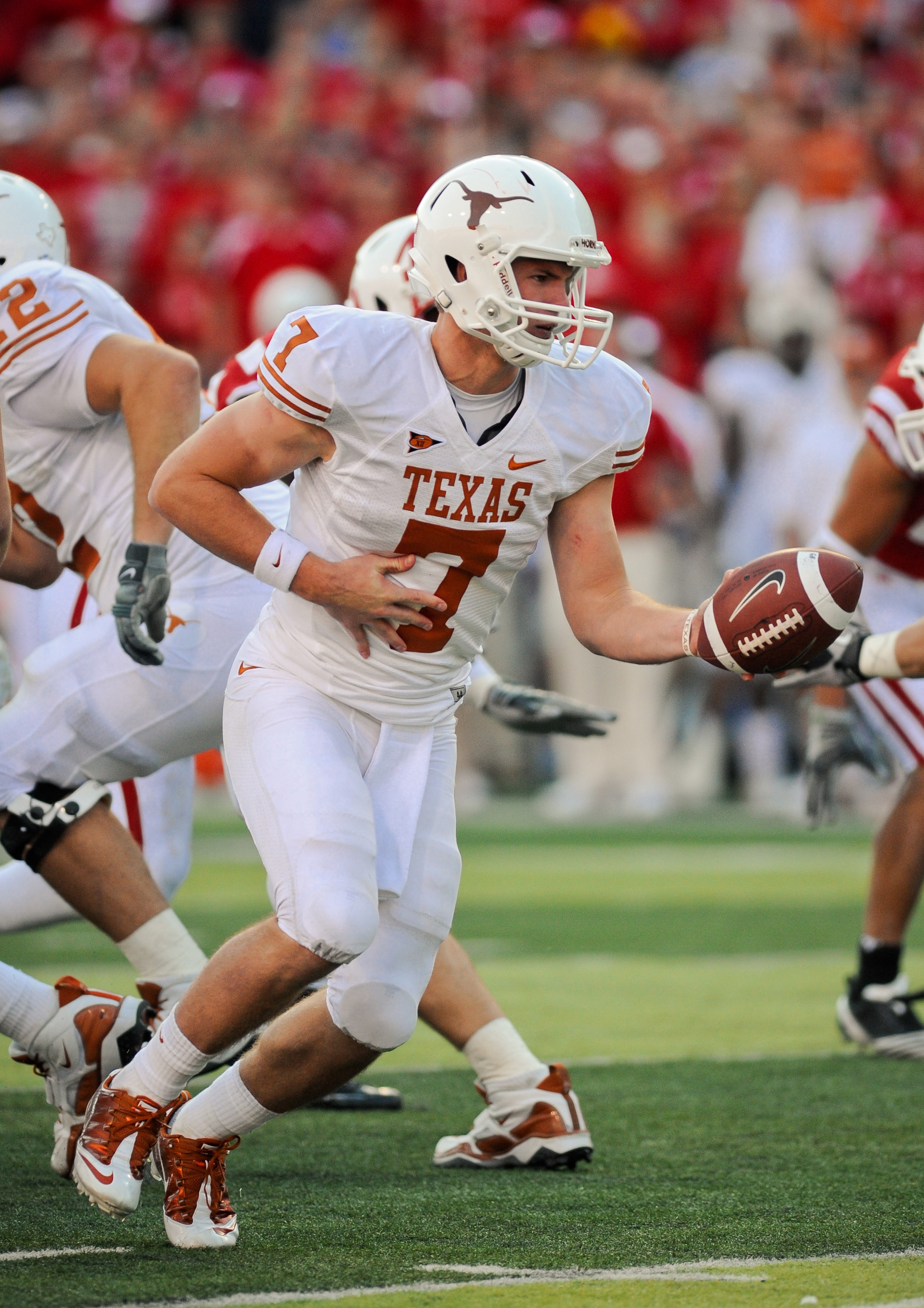 LINCOLN, NE - OCTOBER 16: Quarterback Garrett Gilbert #7 of the Texas Longhorns prepares to hand the ball off during their game at Memorial Stadium on October 16, 2010 in Lincoln, Nebraska. Texas Defeated Nebraska 20-13. (Photo by Eric Francis/Getty Image