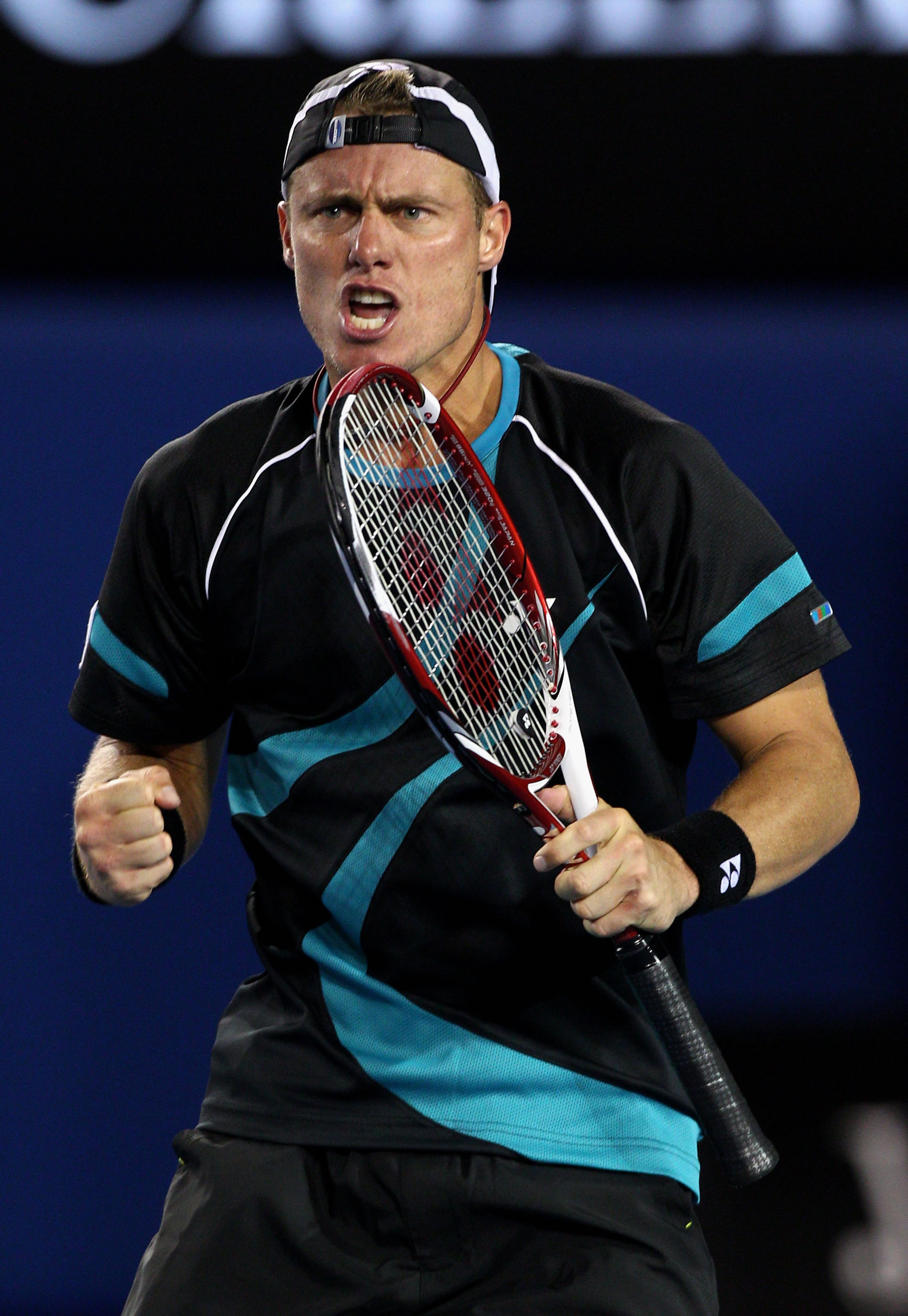 MELBOURNE, AUSTRALIA - JANUARY 18: Lleyton Hewitt of Australia celebrates his third set point in his first round match against David Nalbandian of Argentina during day two of the 2011 Australian Open at Melbourne Park on January 18, 2011 in Melbourne, Aus