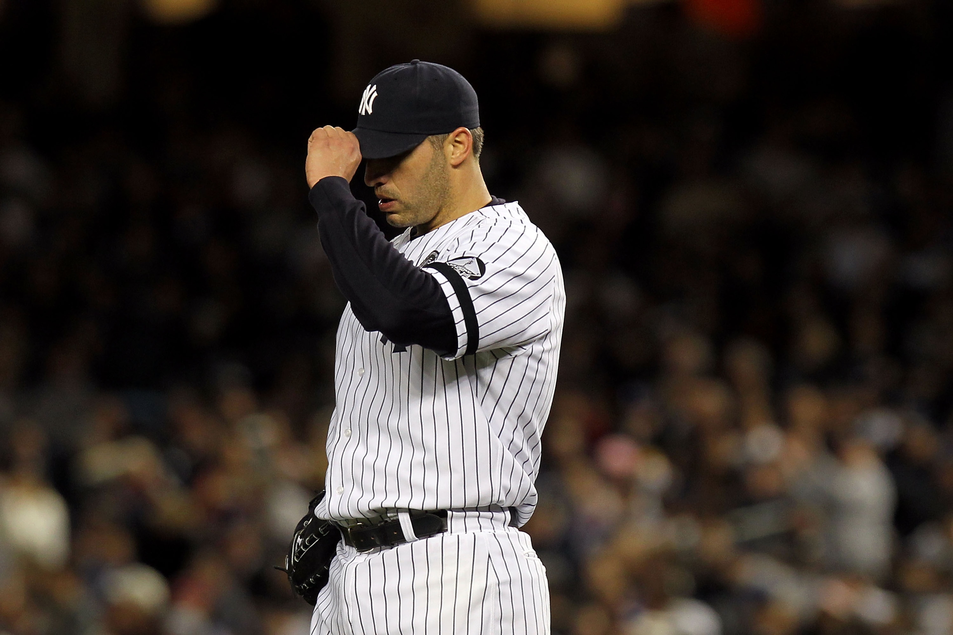 NEW YORK - OCTOBER 18: Andy Pettitte #46 of the New York Yankees adjusts his cap as he reacts against the Texas Rangers in Game Three of the ALCS during the 2010 MLB Playoffs at Yankee Stadium on October 18, 2010 in New York, New York. (Photo by Nick La NEW YORK - OCTOBER 18: Andy Pettitte #46 of the New York Yankees adjusts his cap as he reacts against the Texas Rangers in Game Three of the ALCS during the 2010 MLB Playoffs at Yankee Stadium on October 18, 2010 in New York, New York. (Photo by Nick La