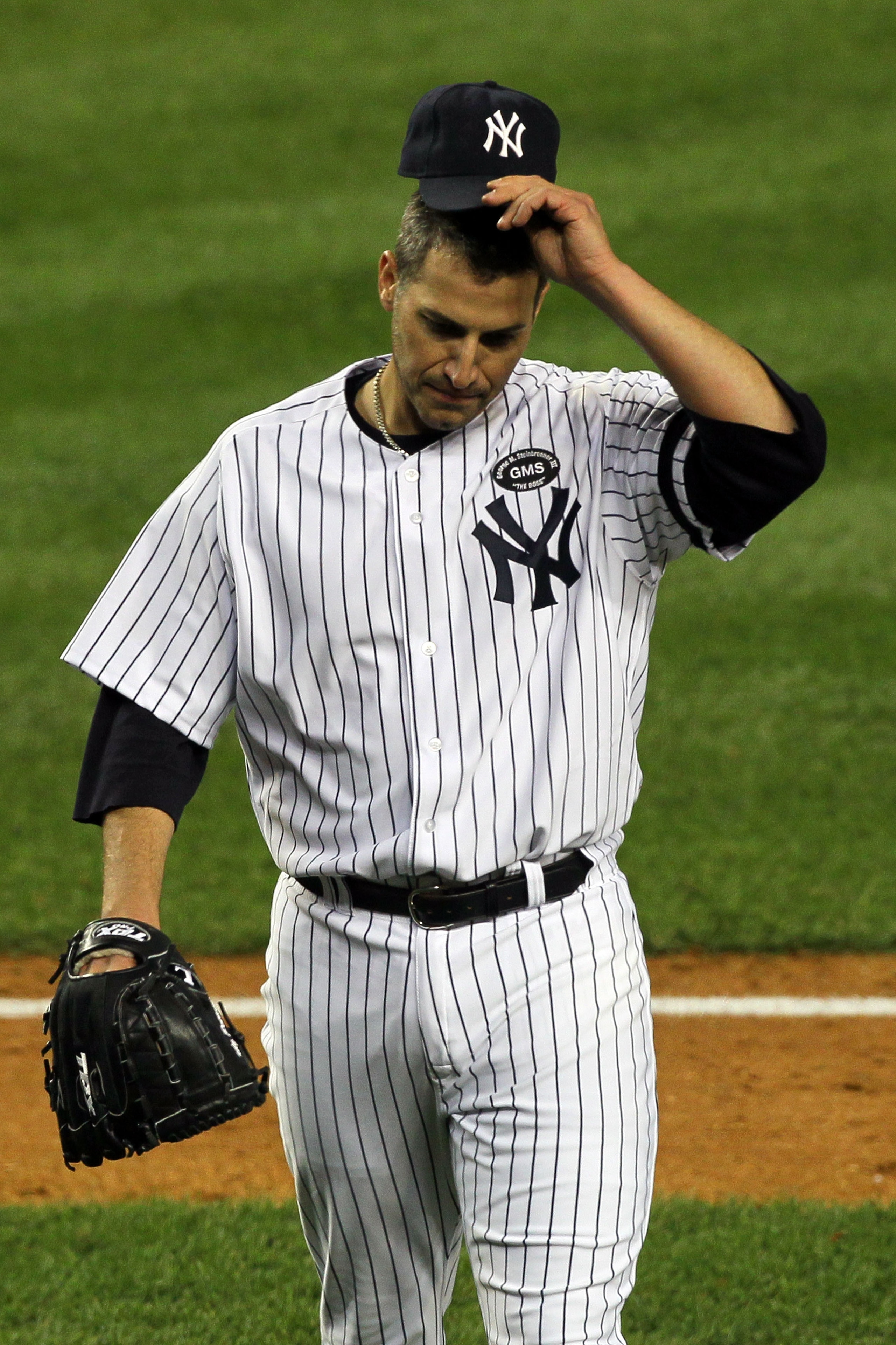 NEW YORK - OCTOBER 18:  Andy Pettitte #46 of the New York Yankees walks back to the dugout at the end of the top of the third inning against the Texas Rangers in Game Three of the ALCS during the 2010 MLB Playoffs at Yankee Stadium on October 18, 2010 in