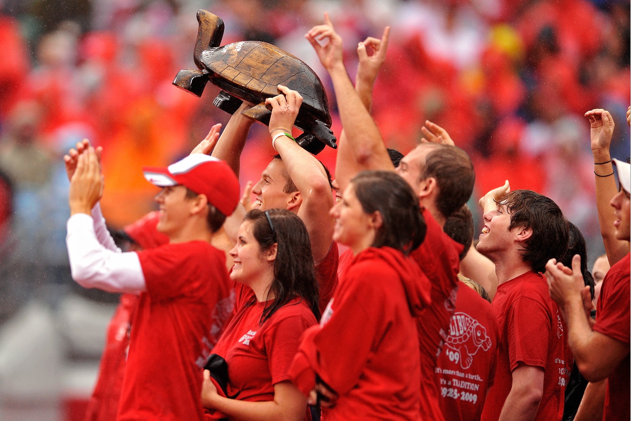COLUMBUS, OH - SEPTEMBER 26:  Ohio State Buckeyes students hoist the Illibuck trophy during the game against the Illinois Fighting Illinois at Ohio Stadium on September 26, 2009 in Columbus, Ohio. The winner of the game gets to keep the trophy on campus u