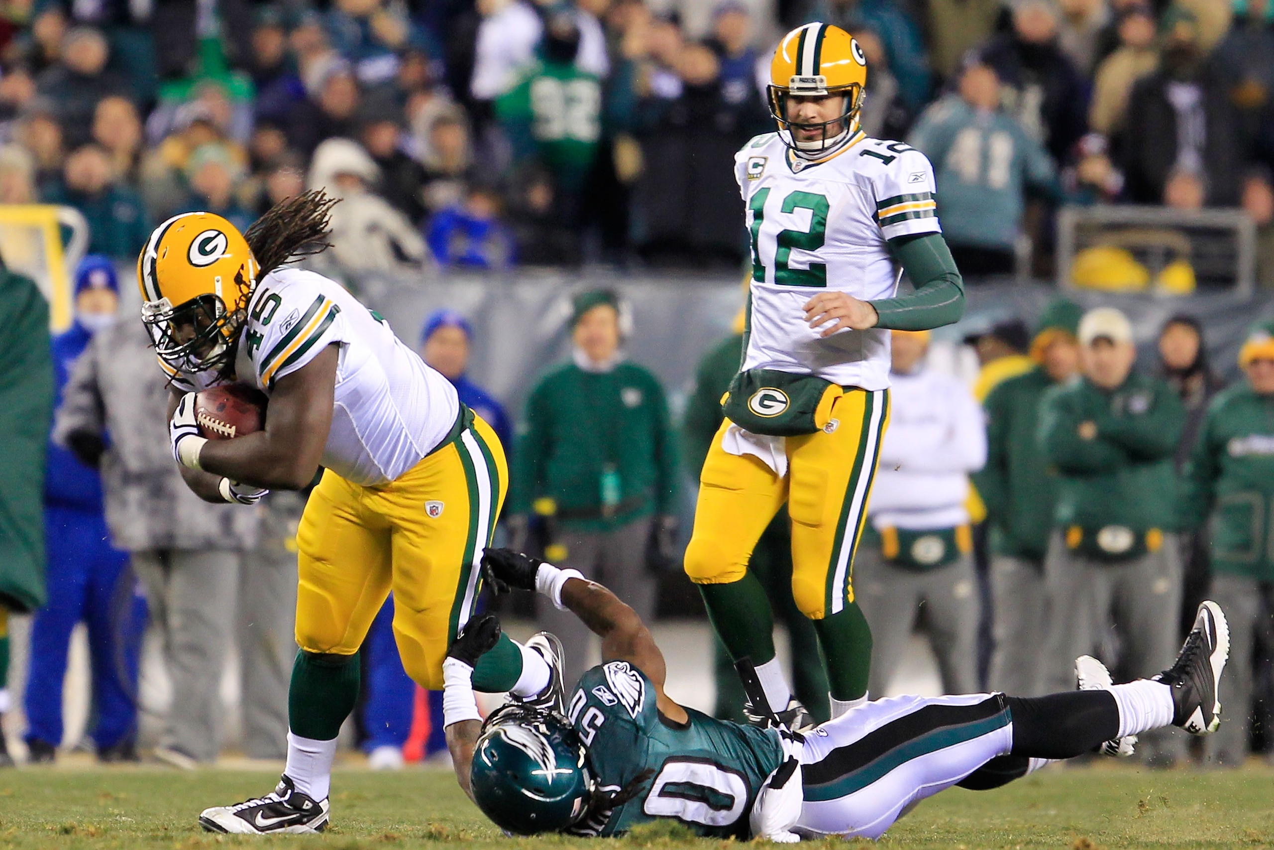 PHILADELPHIA, PA - JANUARY 09: Quinn Johnson #45 of the Green Bay Packers tries to avoid the tackle of Ernie Sims #50 of the Philadelphia Eagles during the 2011 NFC wild card playoff game at Lincoln Financial Field on January 9, 2011 in Philadelphia, Pen PHILADELPHIA, PA - JANUARY 09: Quinn Johnson #45 of the Green Bay Packers tries to avoid the tackle of Ernie Sims #50 of the Philadelphia Eagles during the 2011 NFC wild card playoff game at Lincoln Financial Field on January 9, 2011 in Philadelphia, Pen