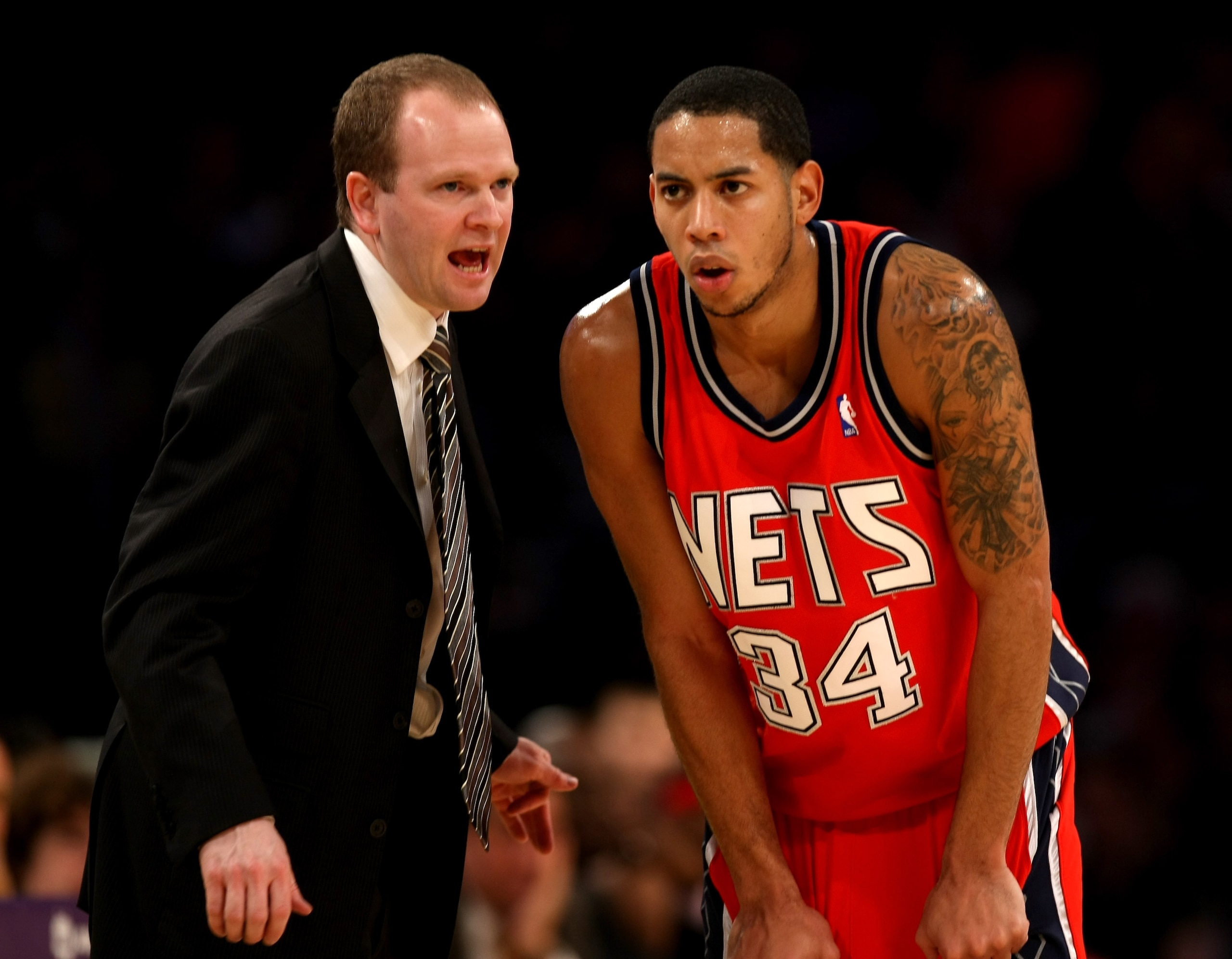 LOS ANGELES, CA - NOVEMBER 25: Head coach Lawrence Frank and Devin Harris #34 of the New Jersey Nets confer during the game with the Los Angeles Lakers on November 25, 2008 at Staples Center in Los Angeles, California. The Lakers won 120-93. NOTE TO US LOS ANGELES, CA - NOVEMBER 25: Head coach Lawrence Frank and Devin Harris #34 of the New Jersey Nets confer during the game with the Los Angeles Lakers on November 25, 2008 at Staples Center in Los Angeles, California. The Lakers won 120-93. NOTE TO US