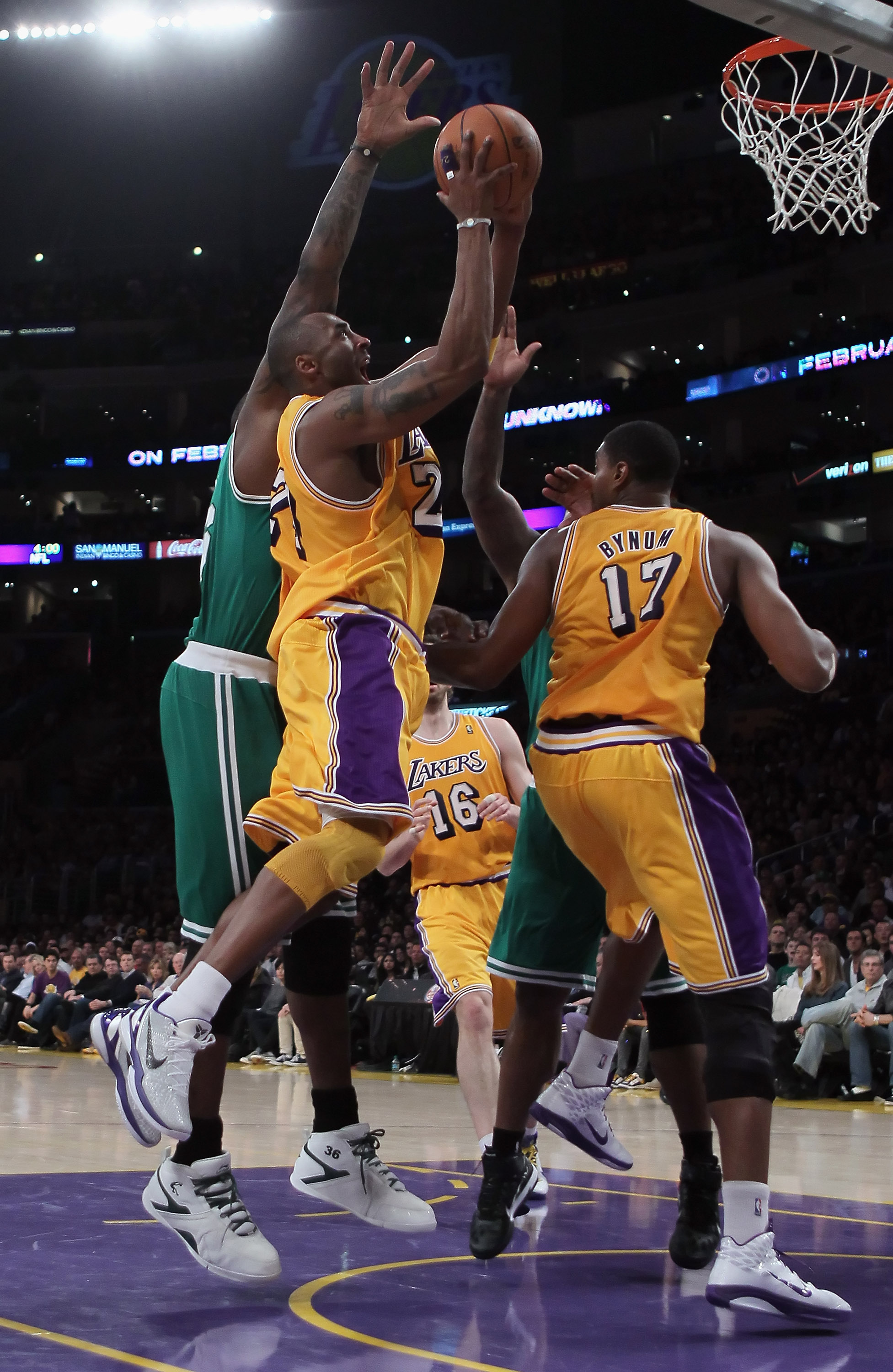 LOS ANGELES, CA - JANUARY 30:  Kobe Bryant #24 of the Los Angeles Lakers drives to the basket over teammate Andrew Bynum #17 against the Boston Celtics in the second half at Staples Center on January 30, 2011 in Los Angeles, California. The Celtics defeat