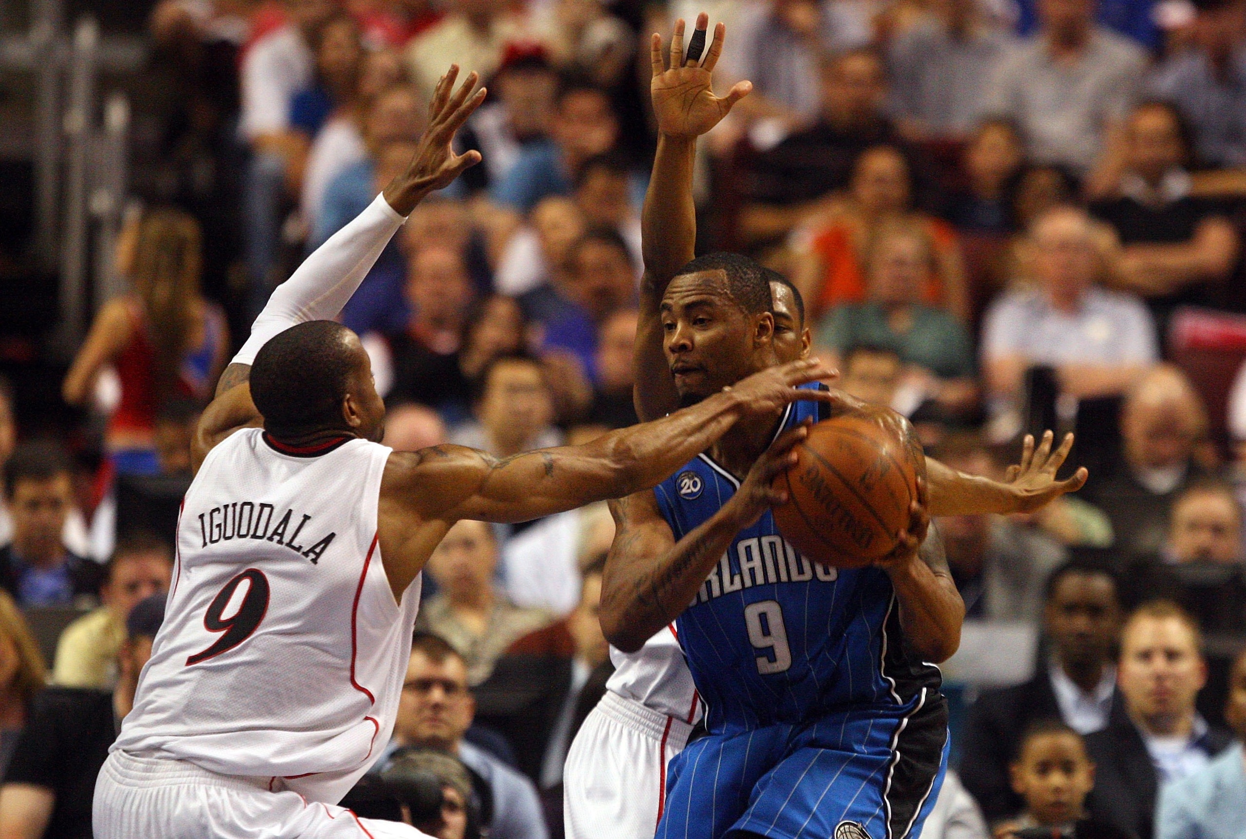 PHILADELPHIA - APRIL 26: Andre Iguodala #9 of the Philadelphia 76ers defends against Rashard Lewis #9 of the Orlando Magic during Game Four of the Eastern Conference Quarterfinals during the 2009 NBA Playoffs at the Wachovia Center on April 26, 2009 in P PHILADELPHIA - APRIL 26: Andre Iguodala #9 of the Philadelphia 76ers defends against Rashard Lewis #9 of the Orlando Magic during Game Four of the Eastern Conference Quarterfinals during the 2009 NBA Playoffs at the Wachovia Center on April 26, 2009 in P