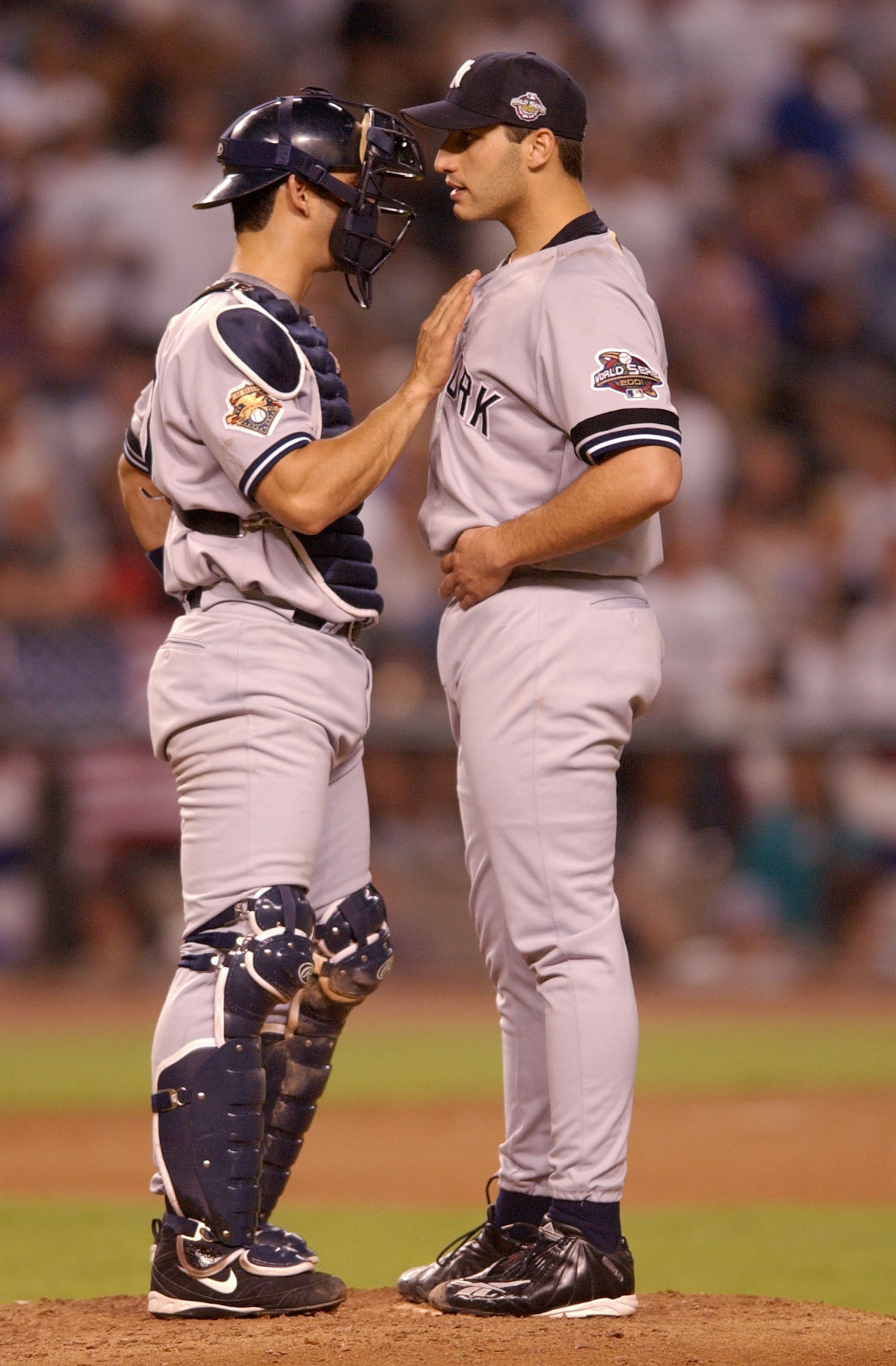 28 Oct 2001: Starting pitcher Andy Pettitte #46 of the New York Yankees confers catcher Jorge Posada #20 in the seventh inning against the Arizona Diamondbacks during game two of the Major League Baseball World Series at Bank One Ballpark in Phoenix, Ariz