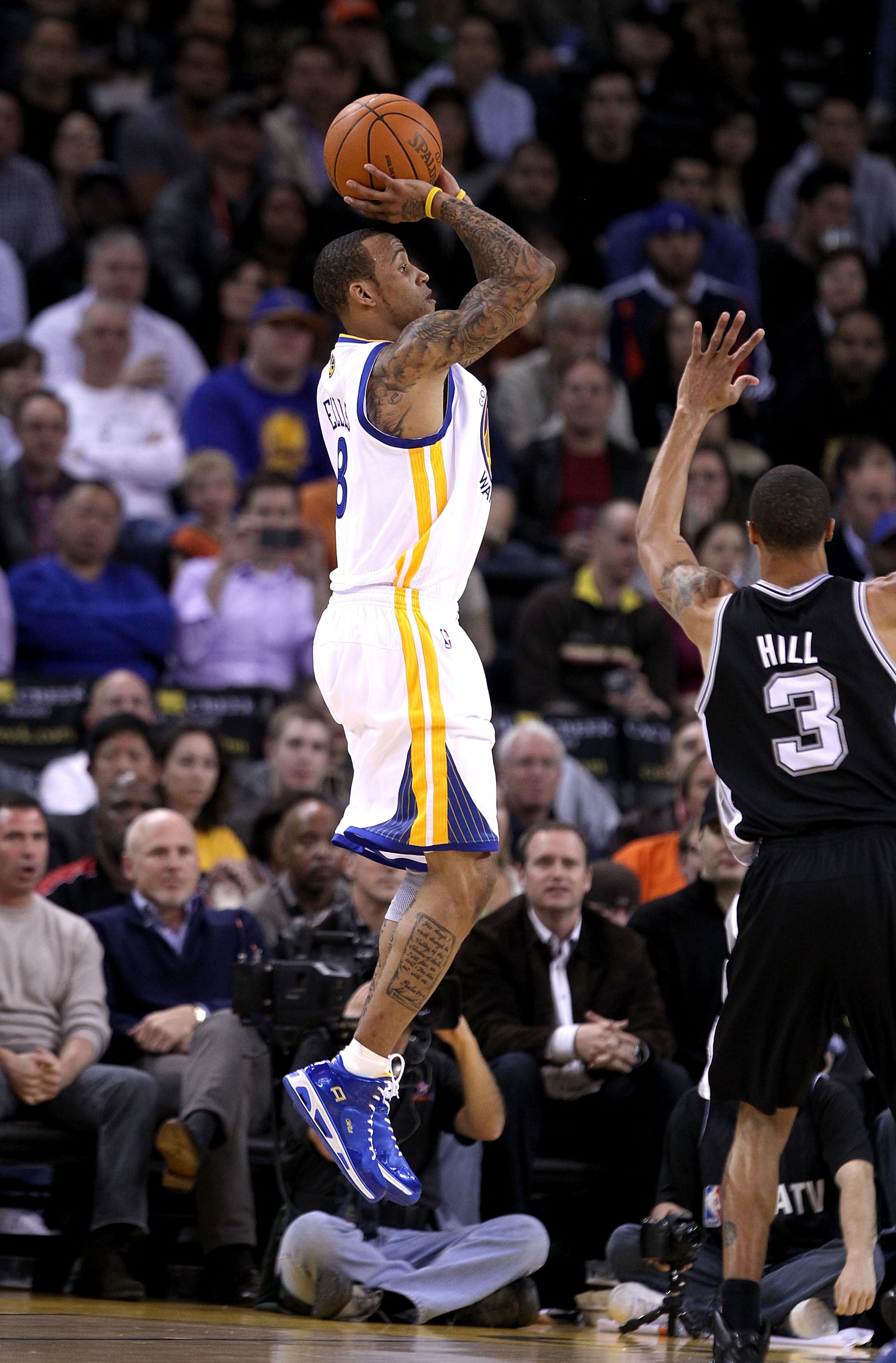 OAKLAND, CA - JANUARY 24:  Monta Ellis #8 of the Golden State Warriors in action against the San Antonio Spurs at Oracle Arena on January 24, 2011 in Oakland, California.  NOTE TO USER: User expressly acknowledges and agrees that, by downloading and or us