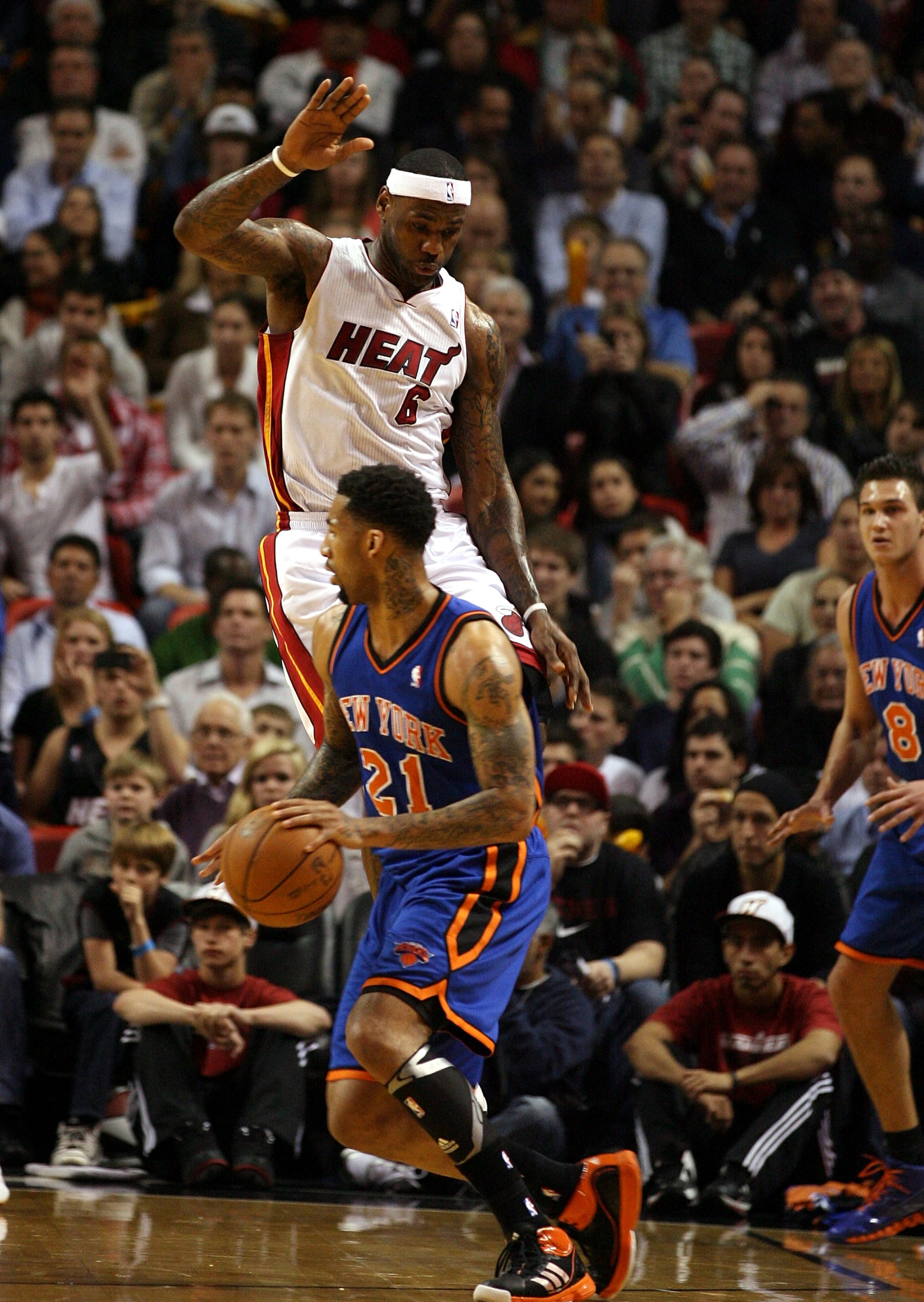 MIAMI - DECEMBER 28: LeBron James #6 of the Miami Heat shoots defends against Wilson Chandler #21 of the New York Knicks at American Airlines Arena on December 28, 2010 in Miami, Florida. (Photo by Marc Serota/Getty Images) MIAMI - DECEMBER 28: LeBron James #6 of the Miami Heat shoots defends against Wilson Chandler #21 of the New York Knicks at American Airlines Arena on December 28, 2010 in Miami, Florida. (Photo by Marc Serota/Getty Images)