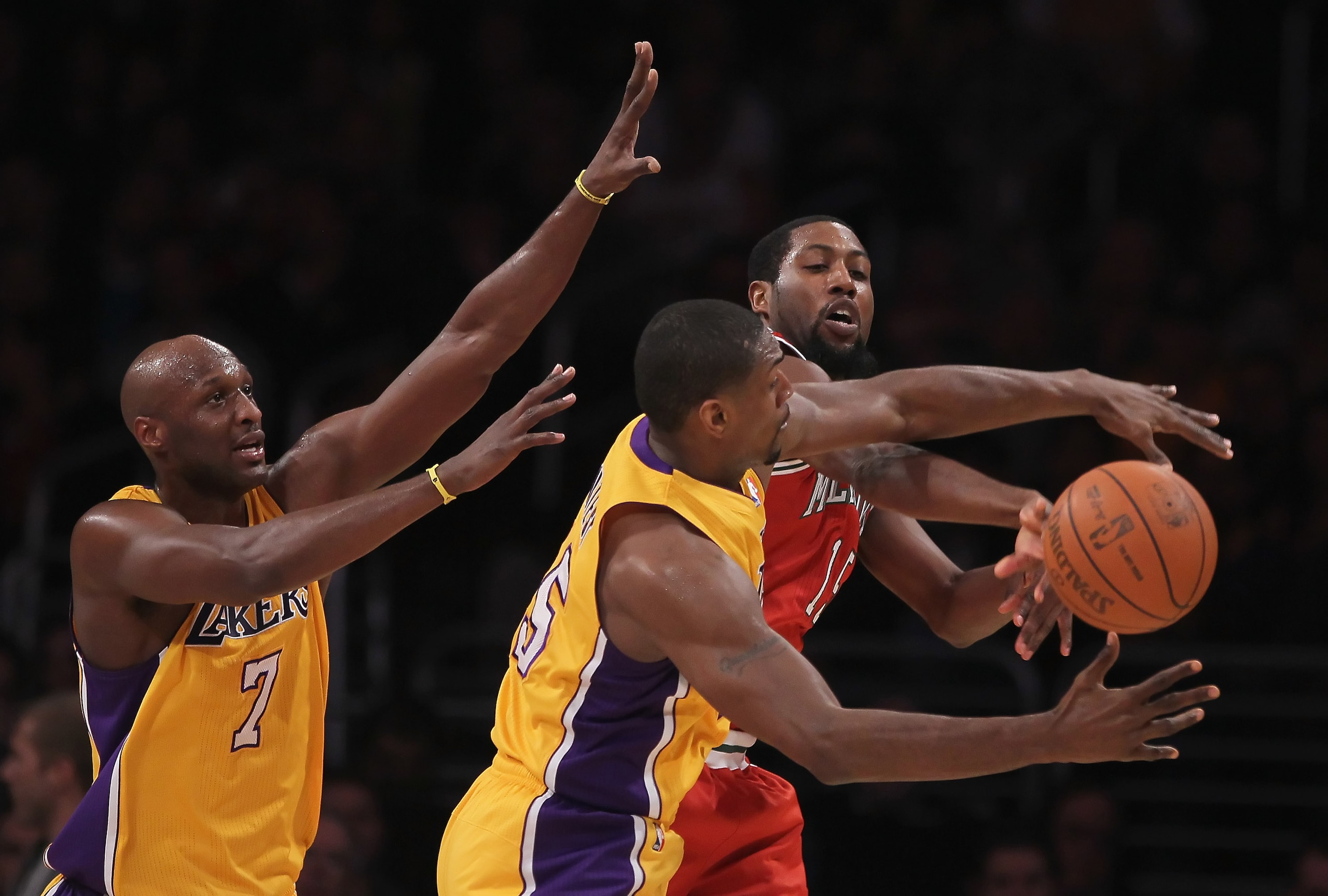 LOS ANGELES, CA - DECEMBER 21: (L-R) Lamar Odom #7 and Ron Artest #15 of the Los Angeles Lakers defend John Salmons #15 of the Milwaukee Bucks during the first half at Staples Center on December 21, 2010 in Los Angeles, California. NOTE TO USER: User exp LOS ANGELES, CA - DECEMBER 21: (L-R) Lamar Odom #7 and Ron Artest #15 of the Los Angeles Lakers defend John Salmons #15 of the Milwaukee Bucks during the first half at Staples Center on December 21, 2010 in Los Angeles, California. NOTE TO USER: User exp