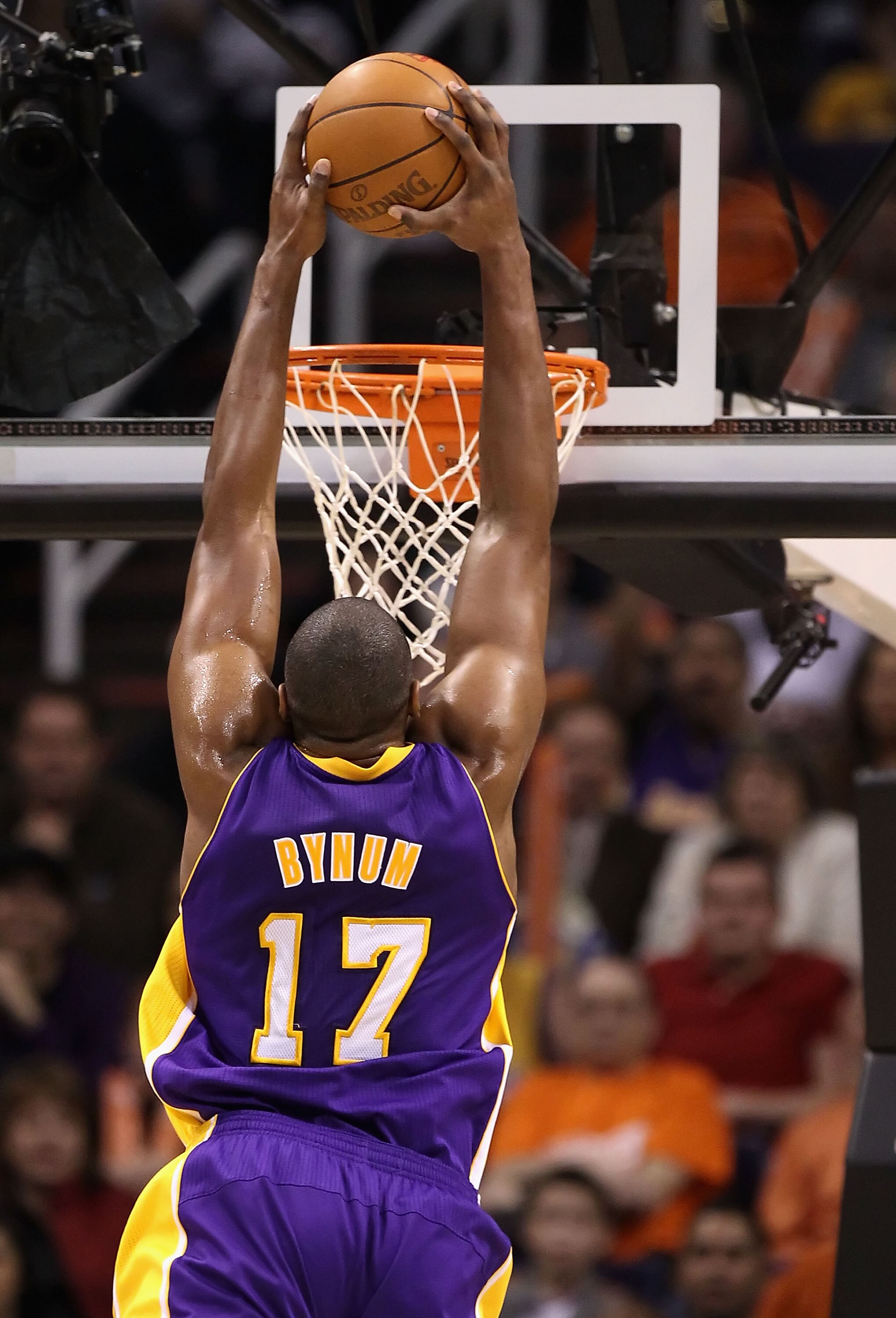 PHOENIX, AZ - JANUARY 05:  Andrew Bynum #17 of the Los Angeles Lakers slam dunks during the NBA game against the Phoenix Suns at US Airways Center on December 23, 2011 in Phoenix, Arizona. The Lakers defeated the Suns 99-95.  NOTE TO USER: User expressly 