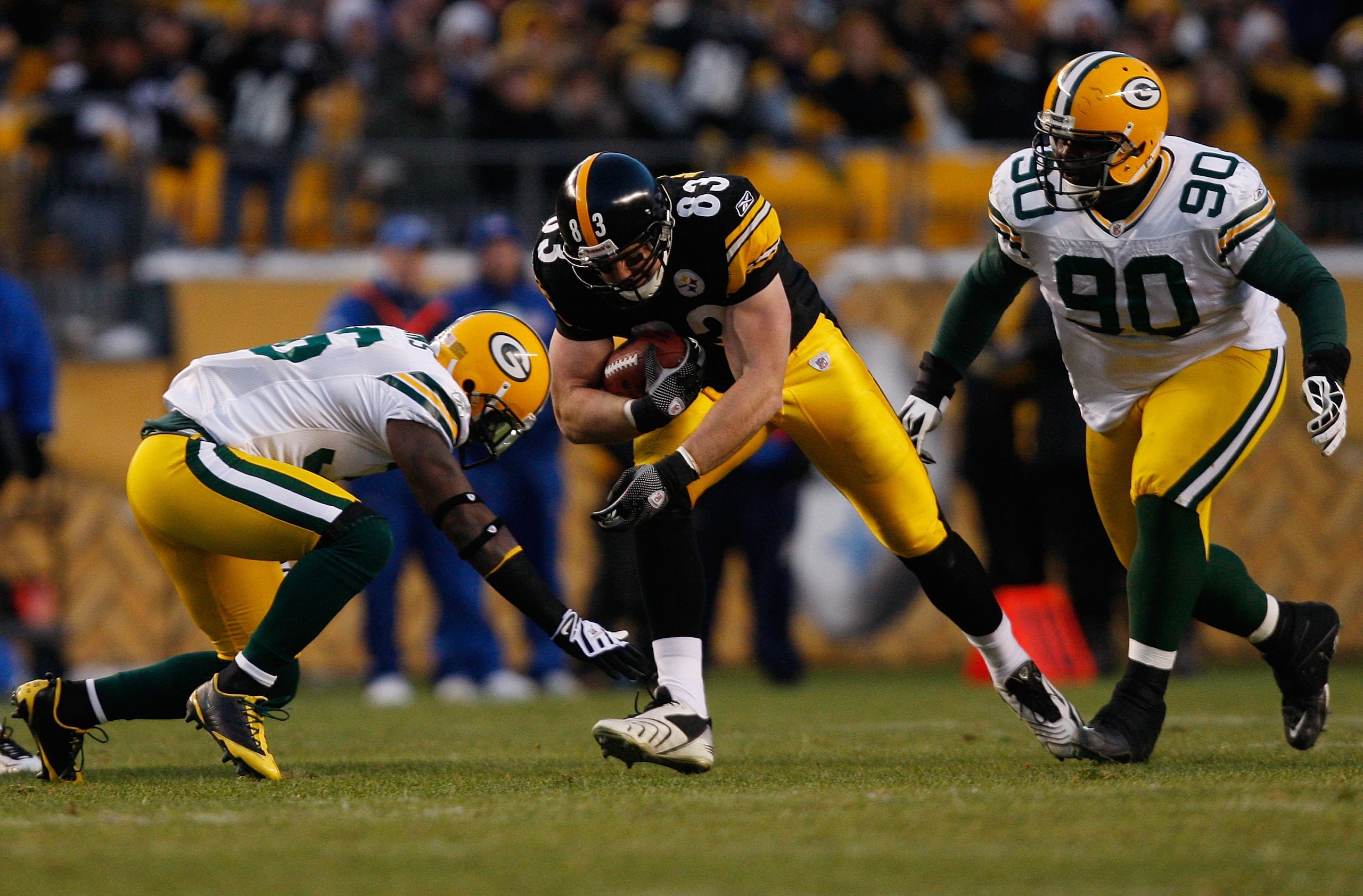PITTSBURGH - DECEMBER 20: Heath Miller #83 of the Pittsburgh Steelers attemps to run through a tackle by BJ Raji #90 and Nick Collins #36 of the Green Bay Packers during the game on December 20, 2009 at Heinz Field in Pittsburgh, Pennsylvania. (Photo by J PITTSBURGH - DECEMBER 20: Heath Miller #83 of the Pittsburgh Steelers attemps to run through a tackle by BJ Raji #90 and Nick Collins #36 of the Green Bay Packers during the game on December 20, 2009 at Heinz Field in Pittsburgh, Pennsylvania. (Photo by J