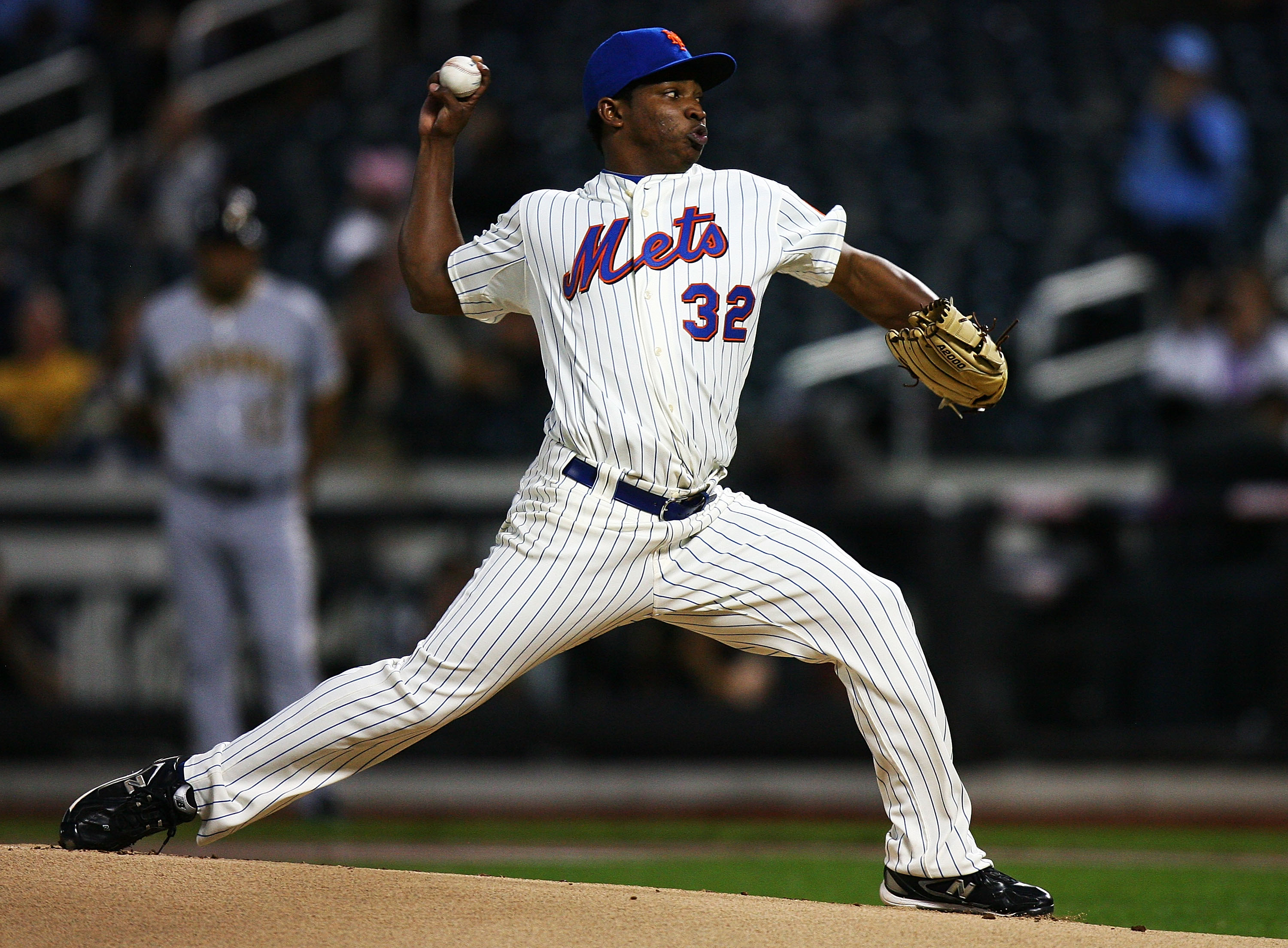 NEW YORK - SEPTEMBER 15:  Jenrry Mejia #32 of the New York Mets pitches against the Pittsburgh Pirates on September 15, 2010 at Citi Field in the Flushing neighborhood of the Queens borough of New York City.  (Photo by Andrew Burton/Getty Images)